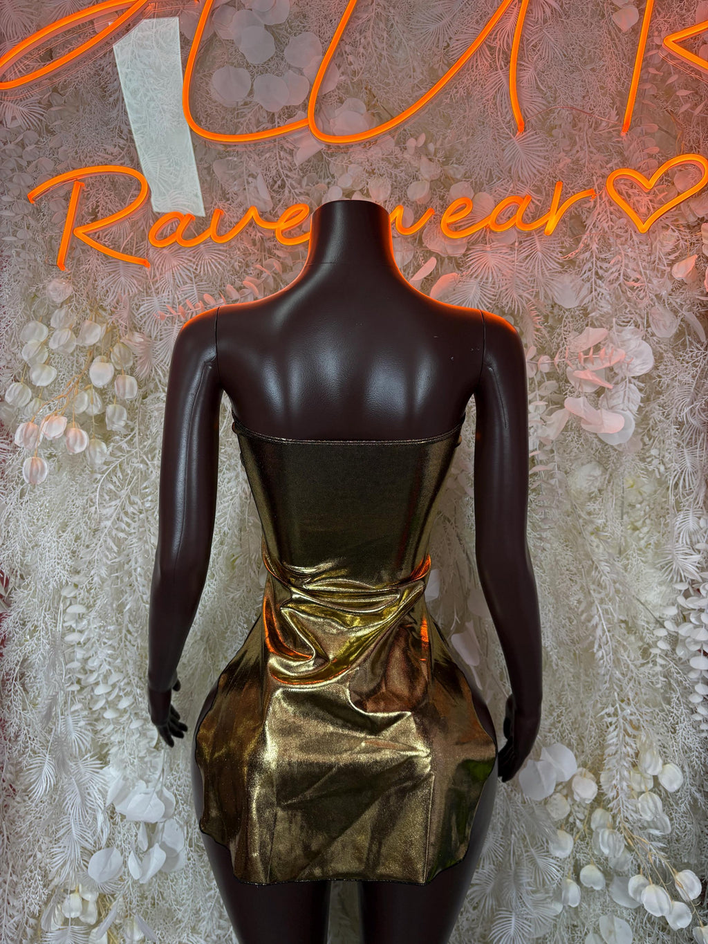 Gold metallic club dress with strapless neckline and draped gold front