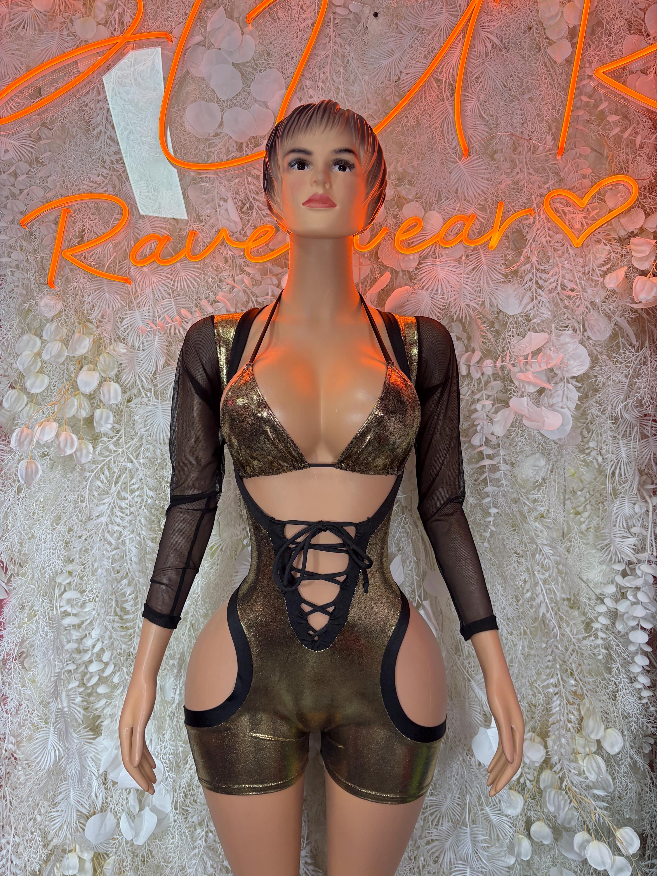 Gold metallic romper bodysuit with black sheer sleeves and lace-up front cutouts