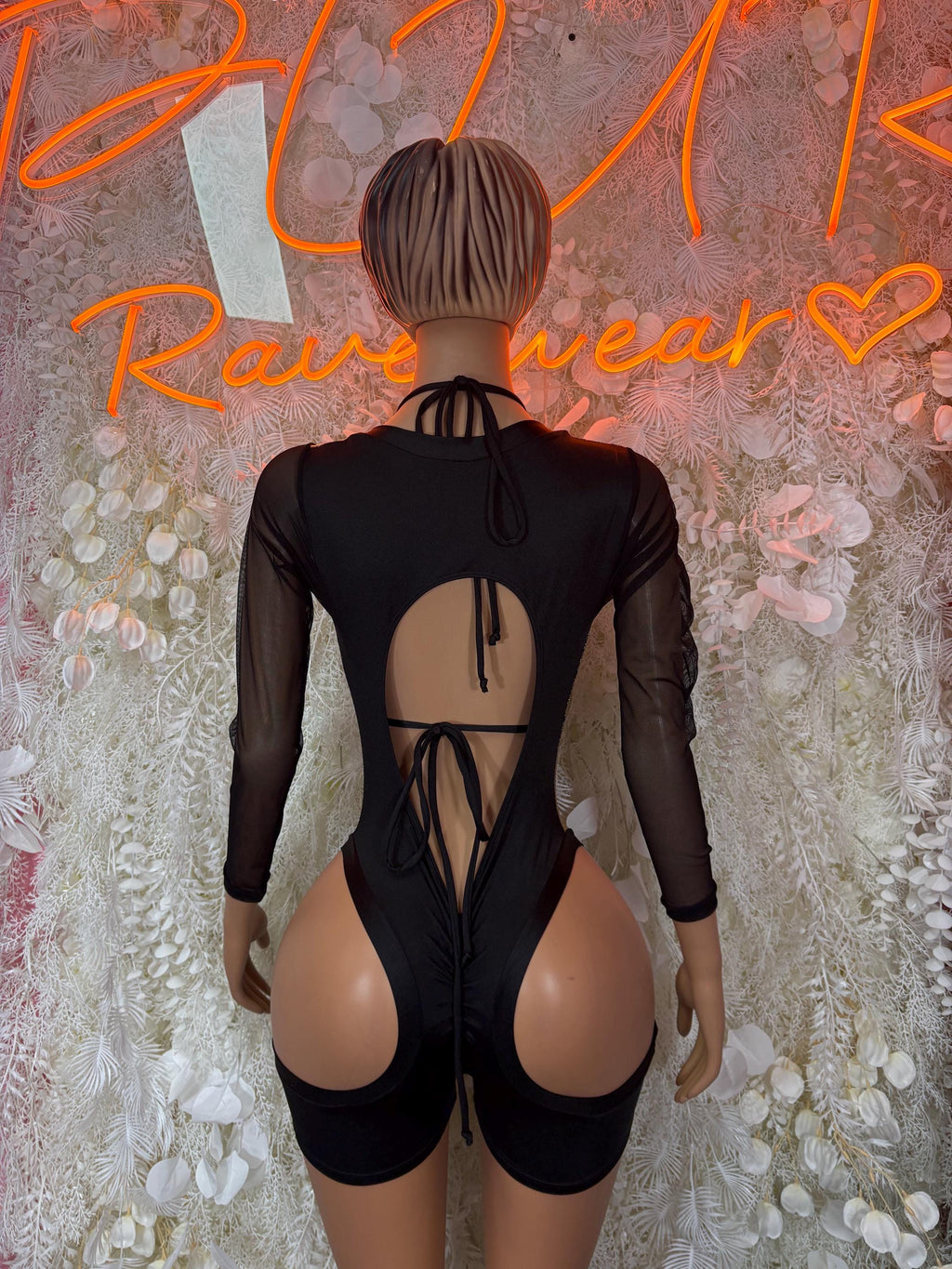 Black sheer backless romper bodysuit with gold metallic center and tie-back detail