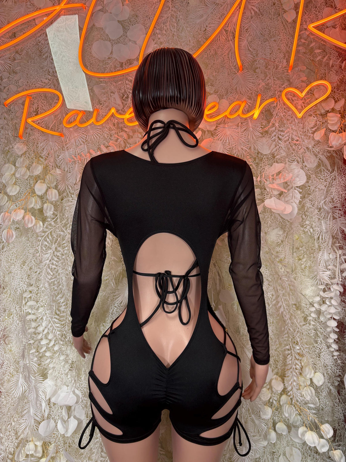 Metallic gold bodysuit with black sheer back, halter straps and open back detail