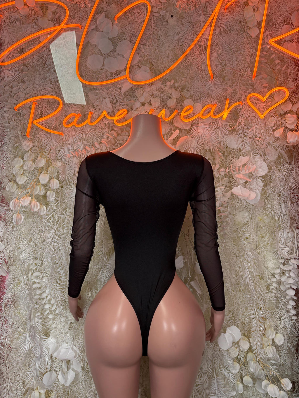 Black long-sleeve bodysuit with scoop neck and lace-up front cutout