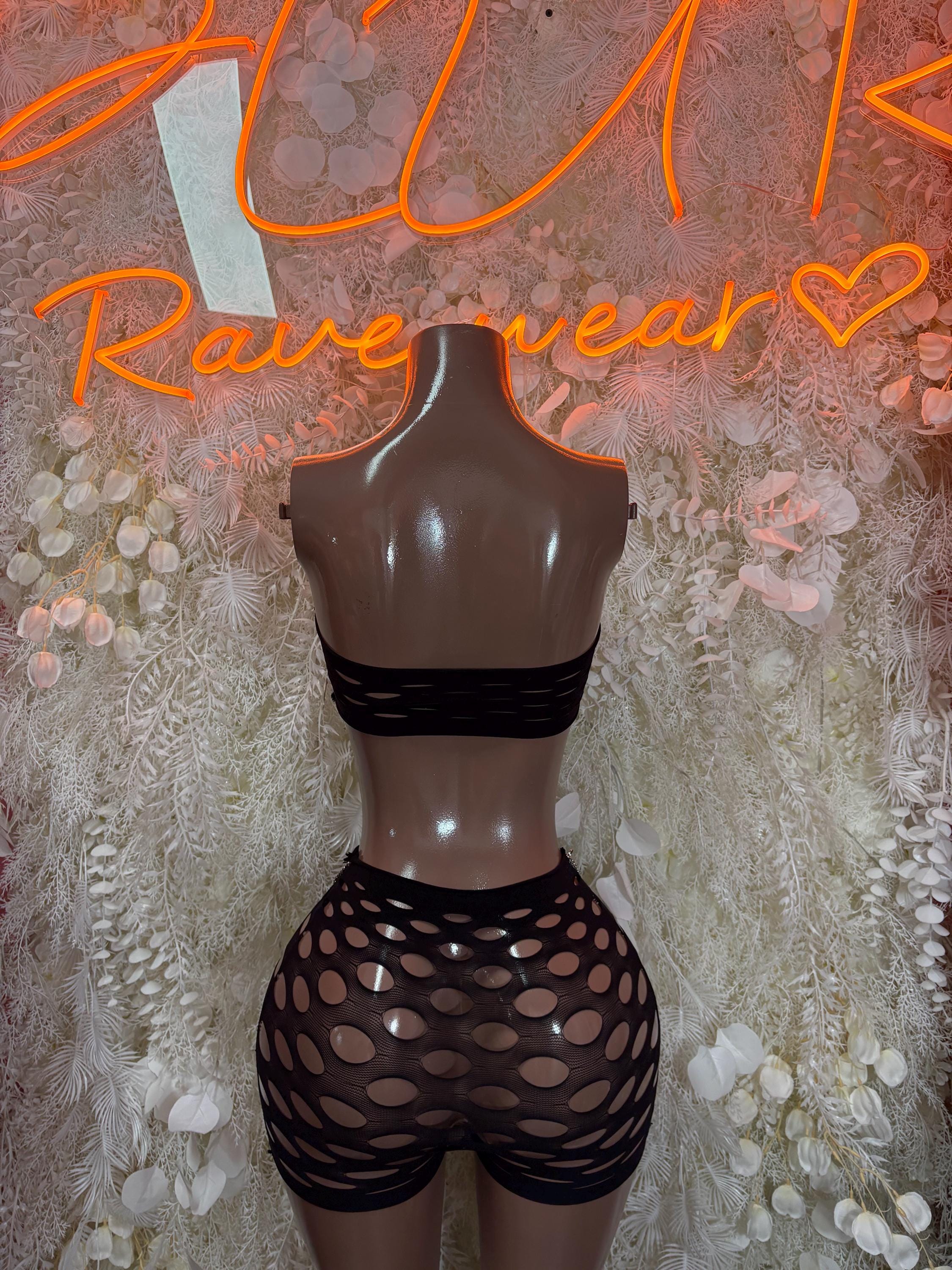 Black backless crop top and fishnet shorts set with oval cutout pattern
