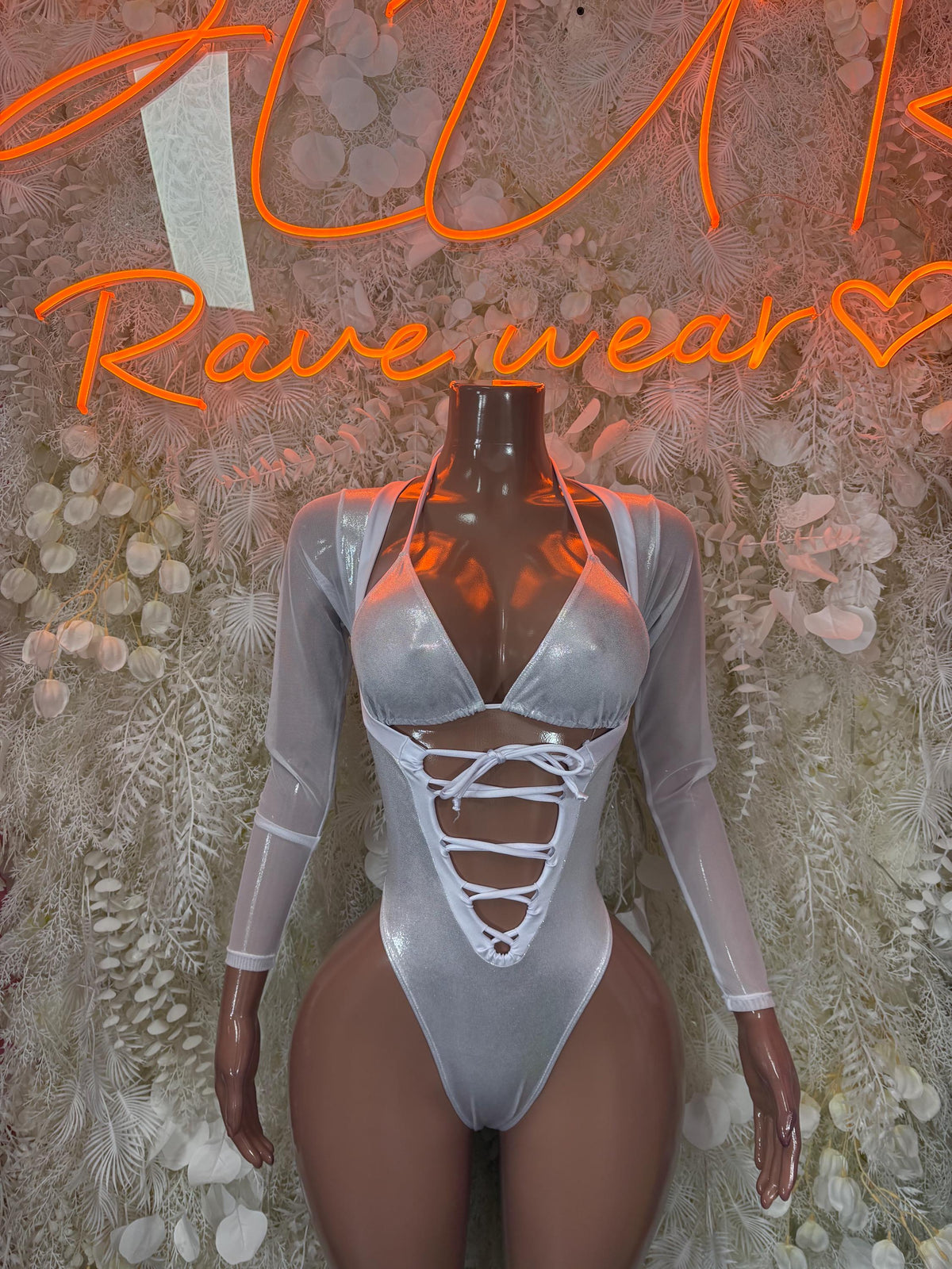 Silver metallic long-sleeve bodysuit with lace-up V neckline and thong cut