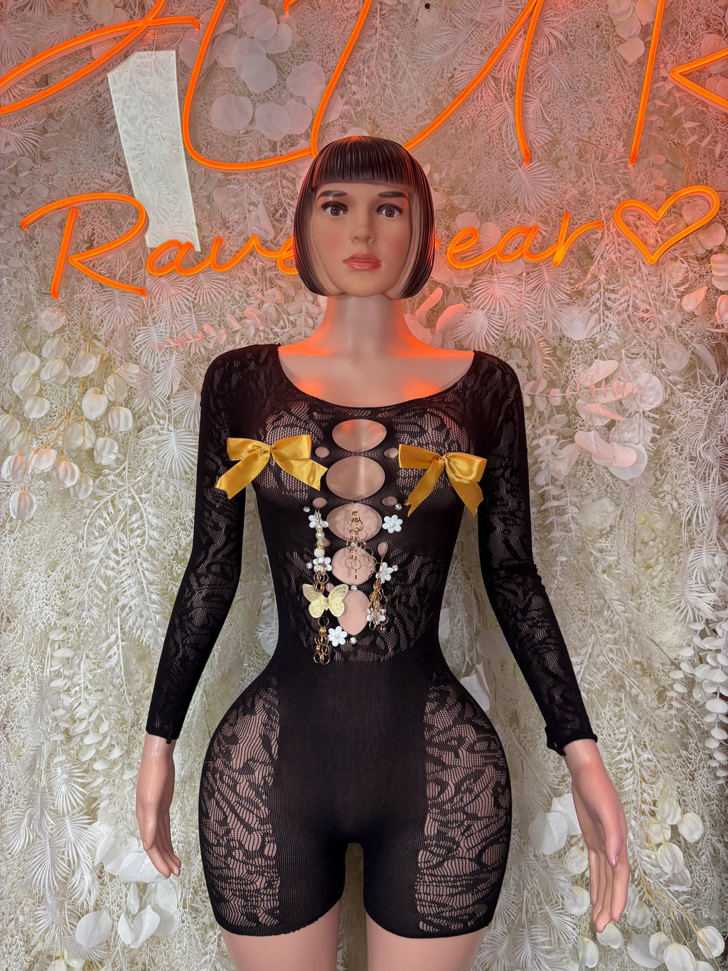 Black lace fishnet bodysuit with long sleeves and oval cutout front detail
