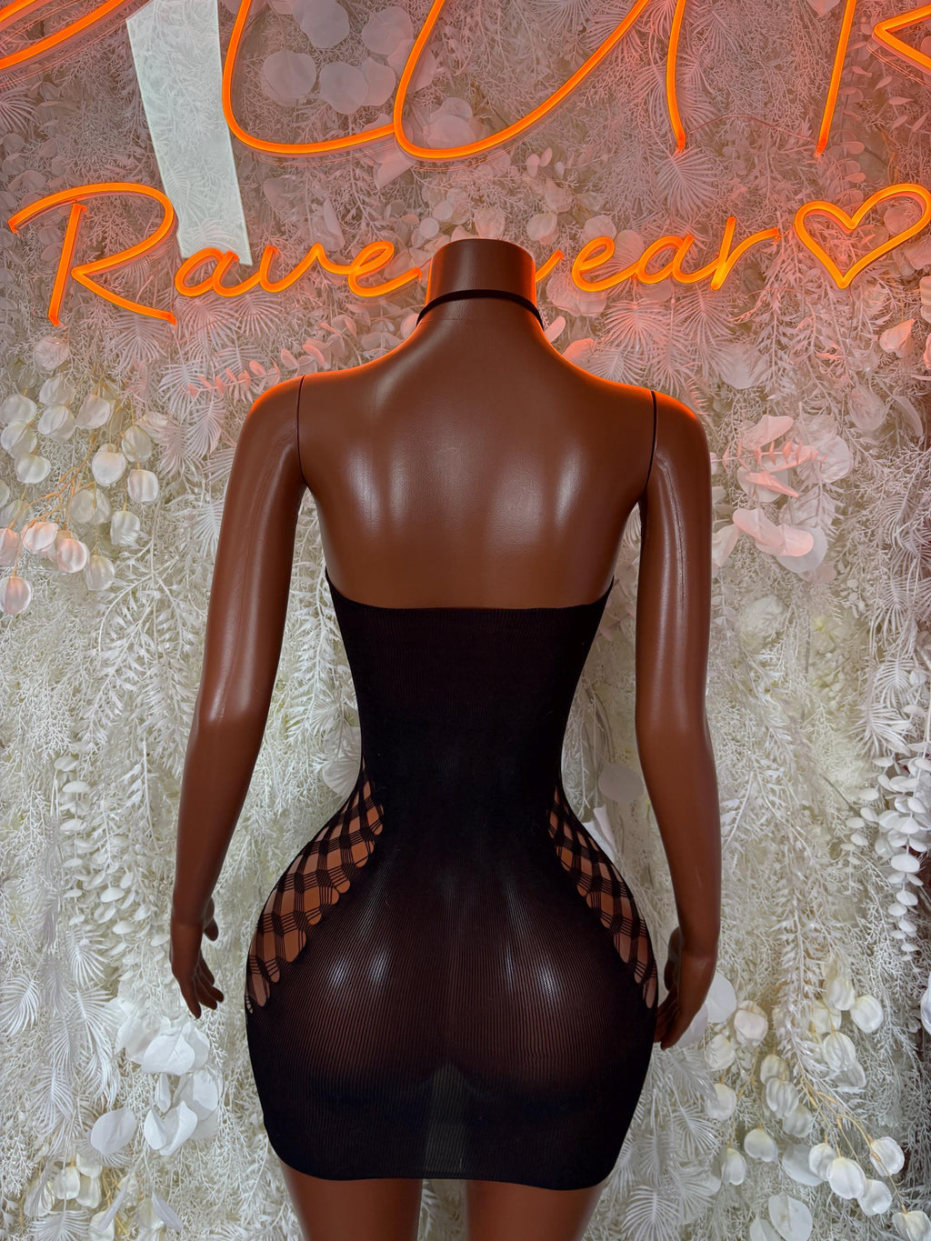 Black fishnet bodysuit, back view with sheer panels and cutout detail