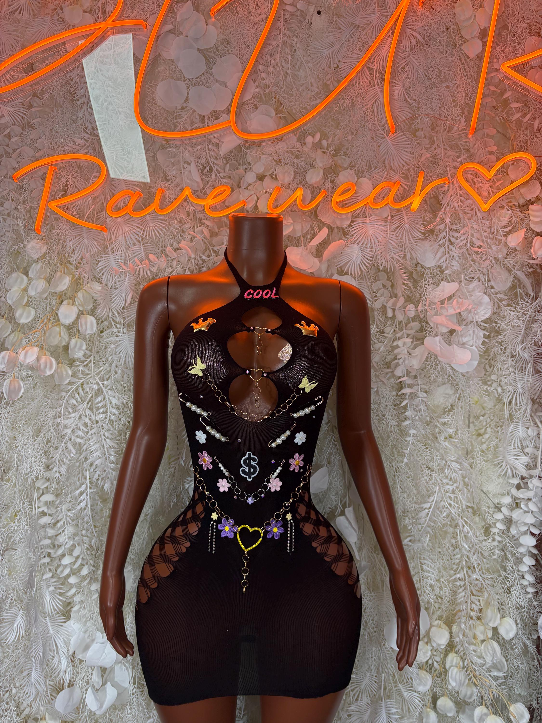 Black fishnet bodysuit with heart cutout and charm necklace graphic detail