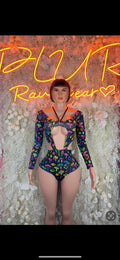Patterned long-sleeve bodysuit with front cutout and dark purple base