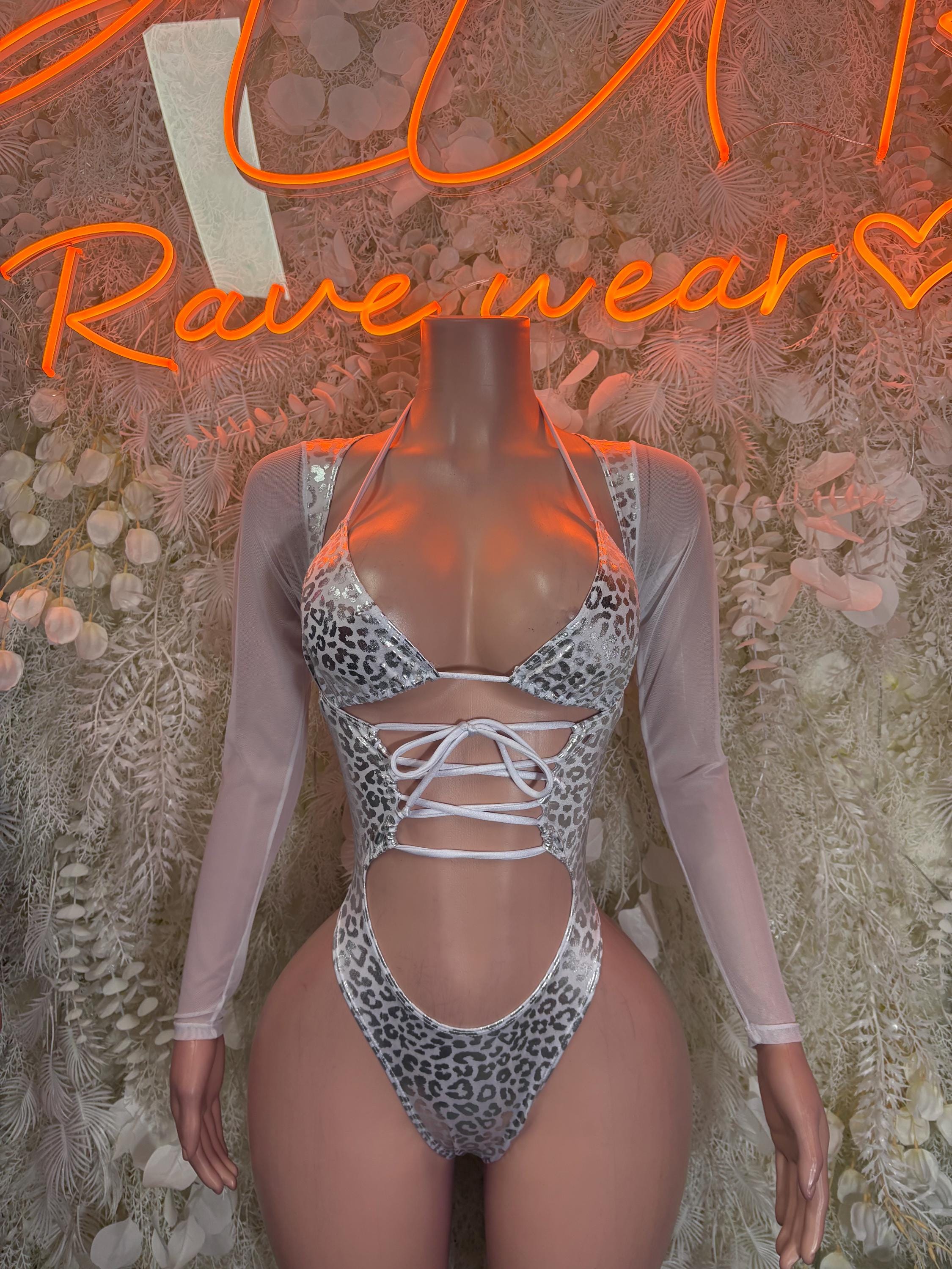 Holographic silver cheetah print rave bodysuit with lace-up front and high-cut leg