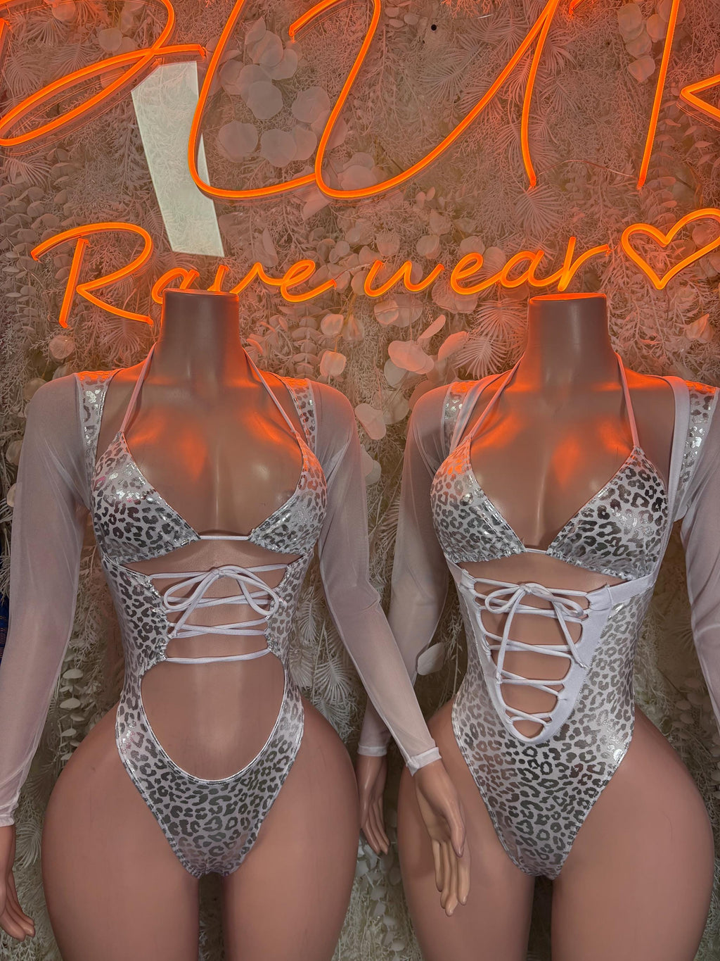 Holographic silver cheetah print rave bodysuit with lace-up chest and center cutout