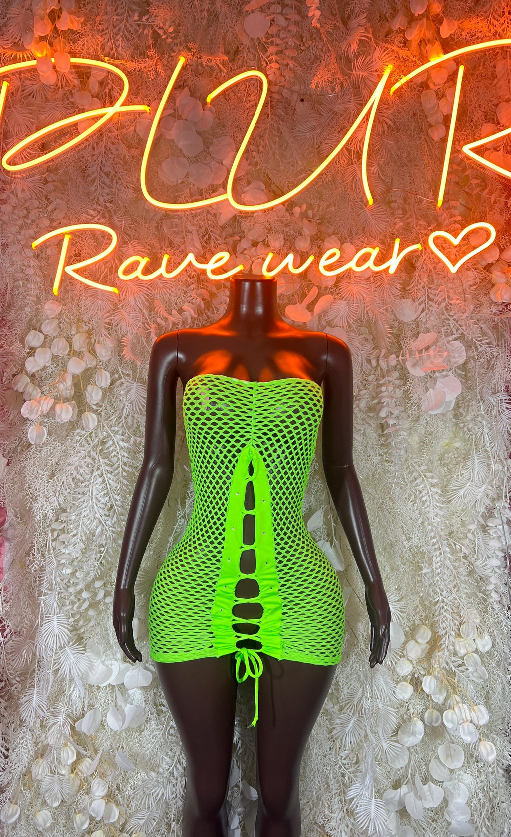 Neon green fishnet mini dress with lace-up front and ruched sides