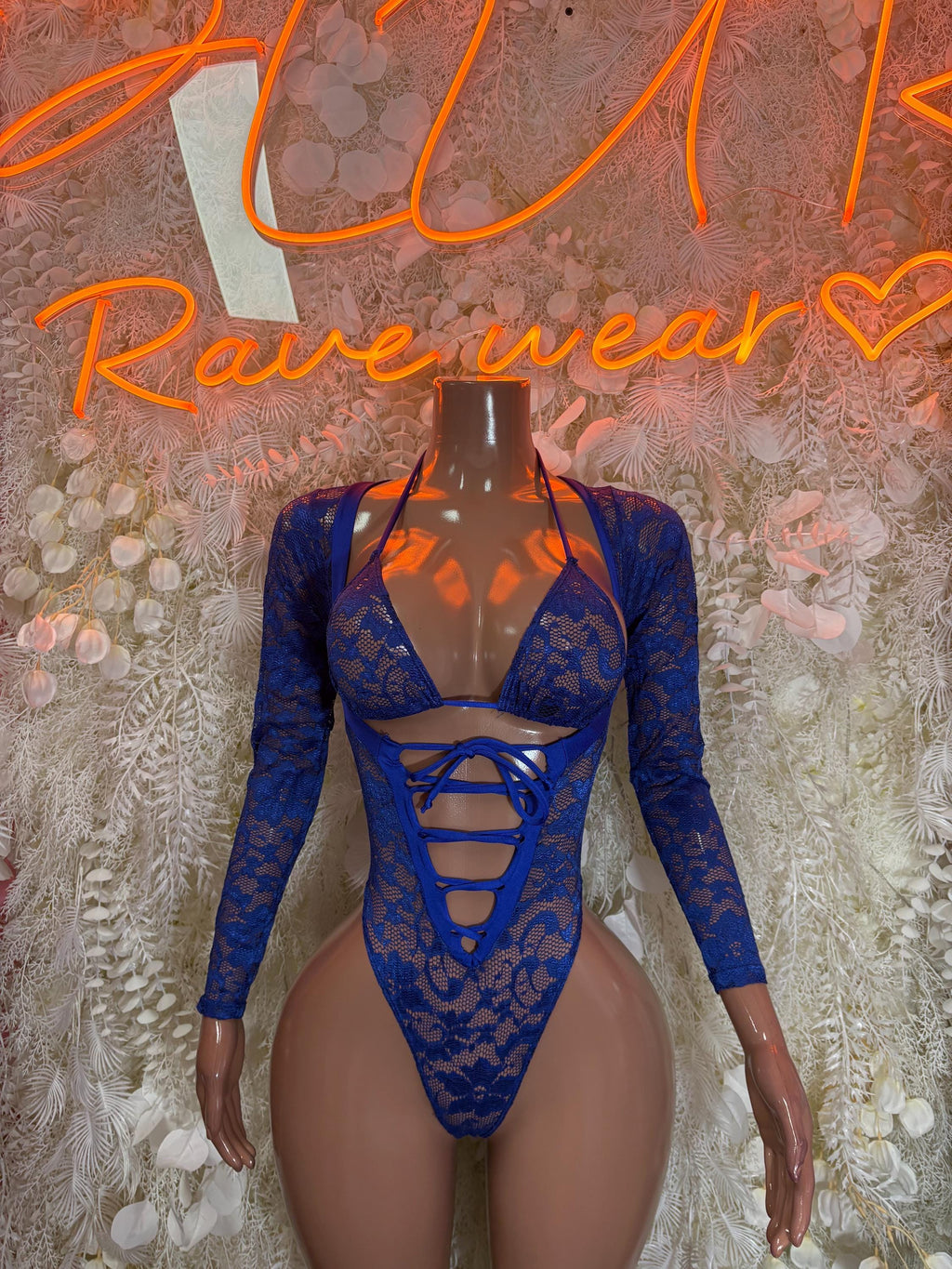 Blue lace bodysuit with long sleeves, lace-up front, and high-cut legs