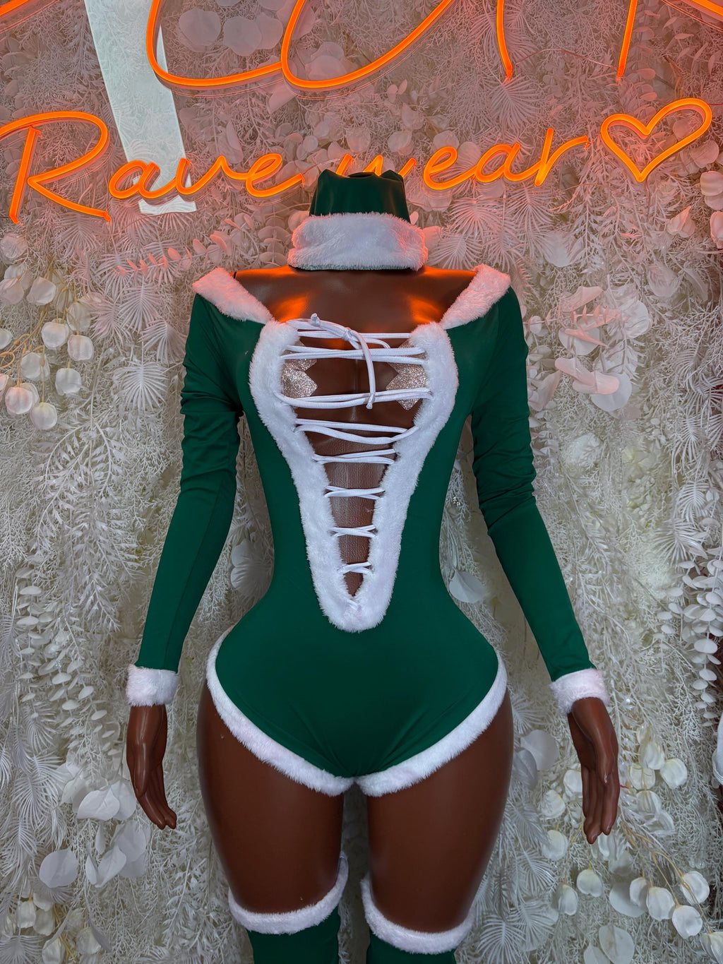 Green elf bodysuit with white trim, lace-up chest, long sleeves, and matching elf hat