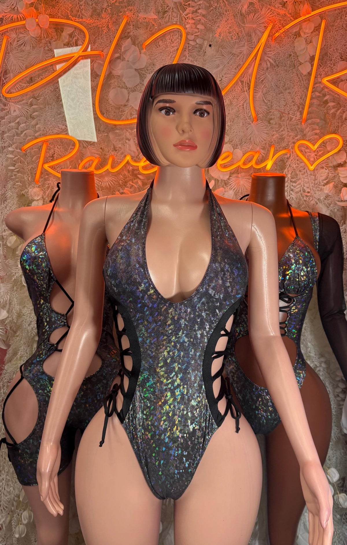 Dark metallic halter bodysuit with plunging neckline and lace-up side cutouts