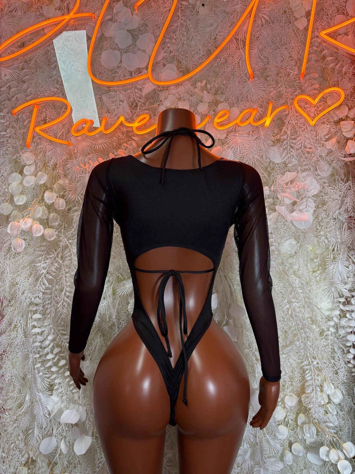 Black mesh bodysuit back view with crisscross tie straps and metallic blue glitter bottom
