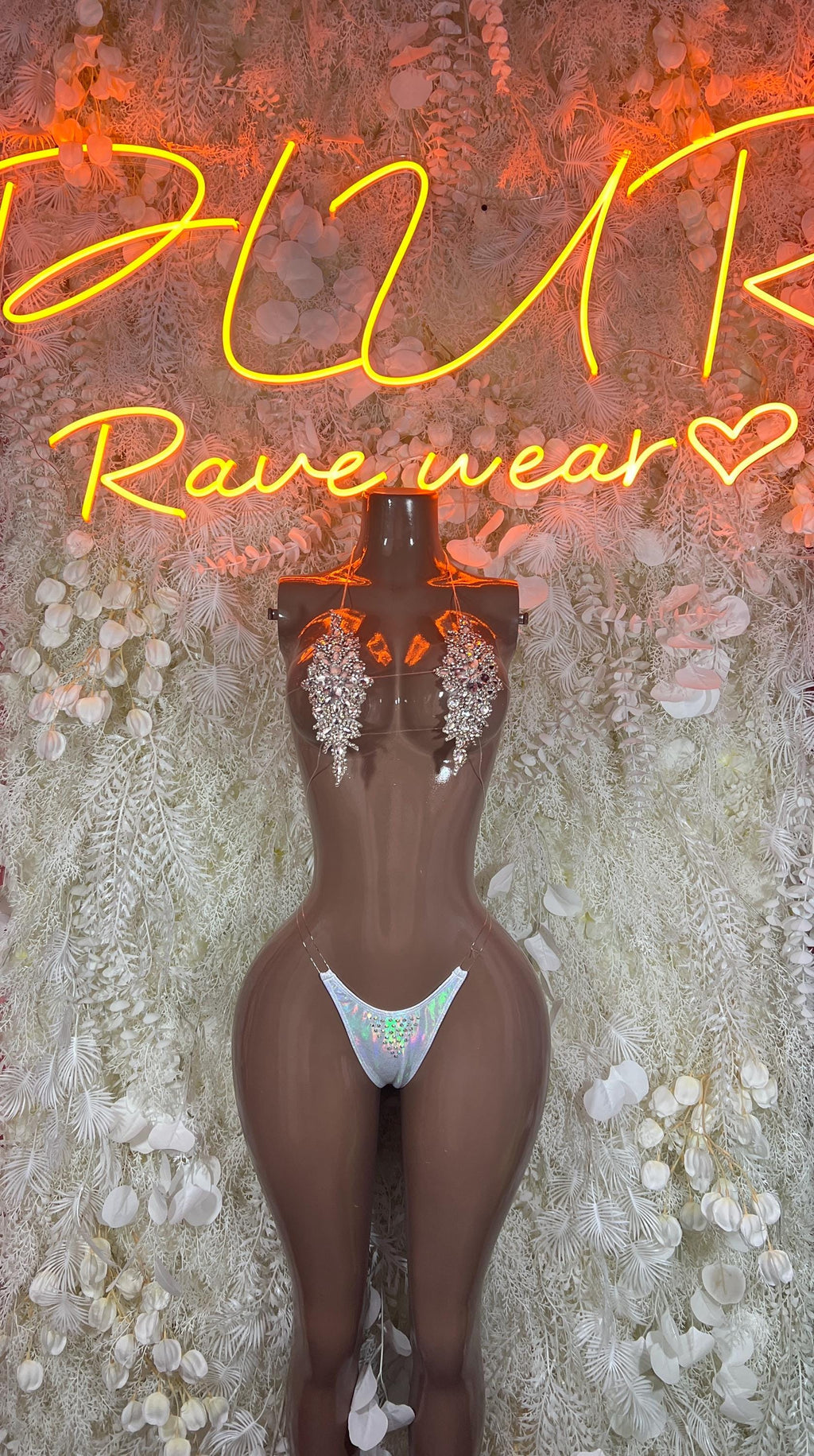 Gold rhinestone bikini set with triangle top and thong bottom on mannequin