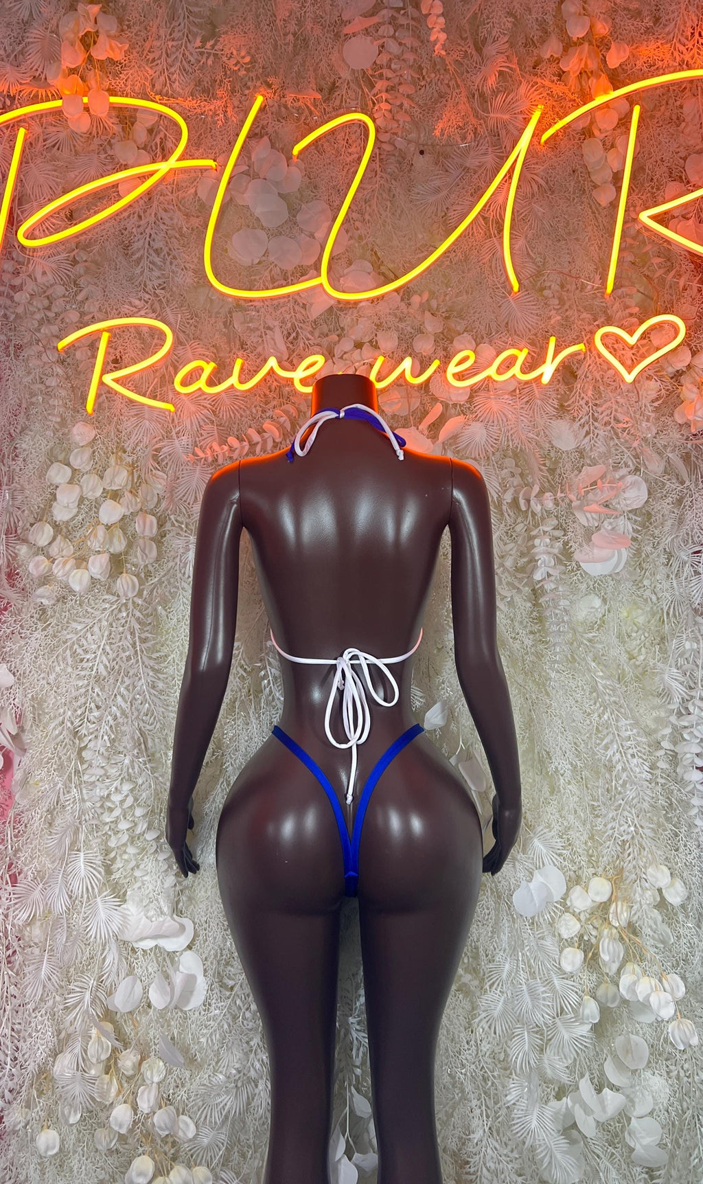Blue two-piece bikini set, string-tie back with halter straps on black mannequin