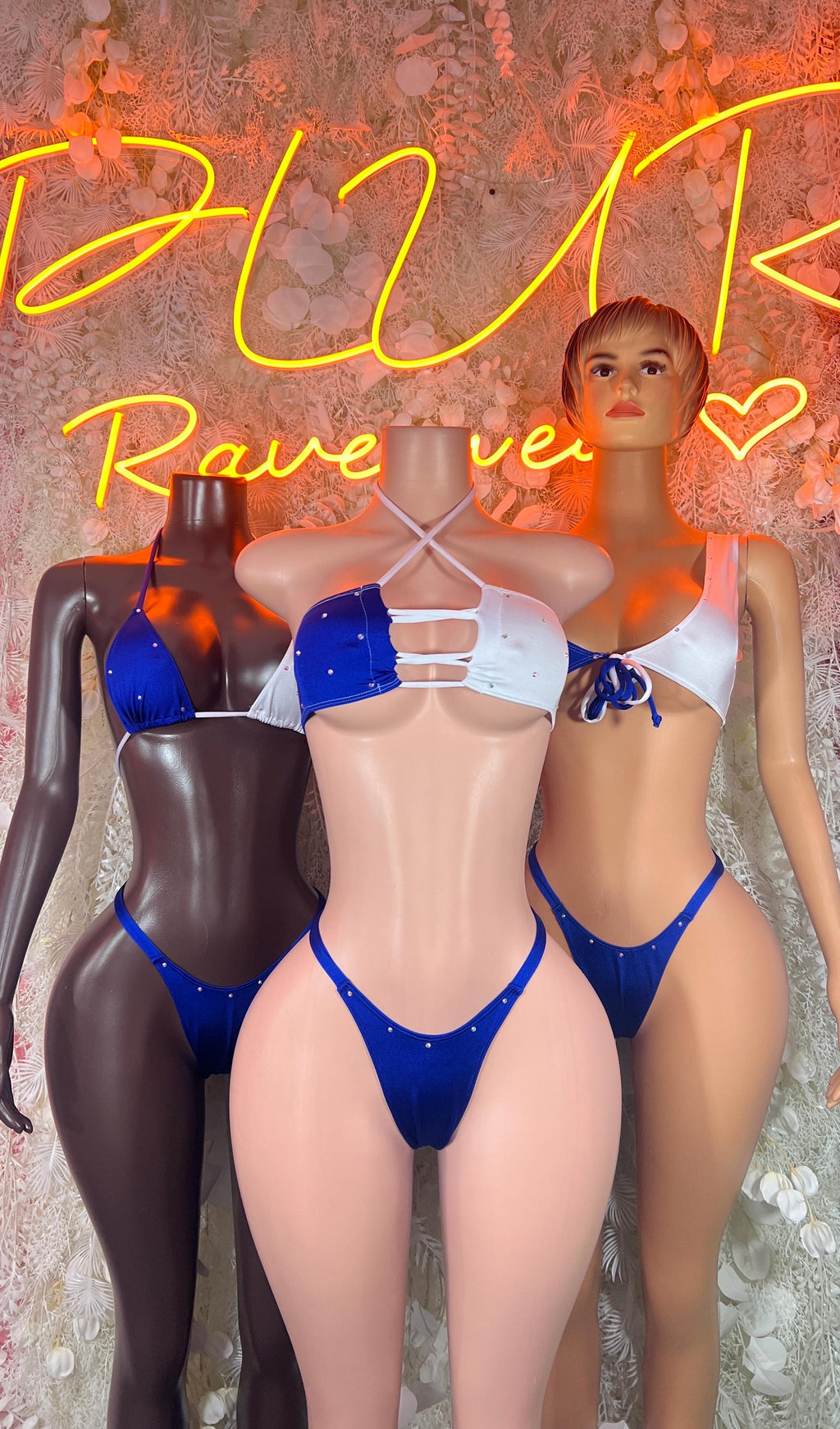 Blue two-piece bikini set with triangle cups and string bottoms on mannequins