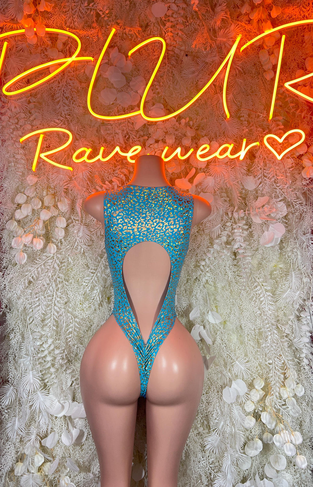 Teal cheetah-print thong-style bodysuit with open back and crisscross ties