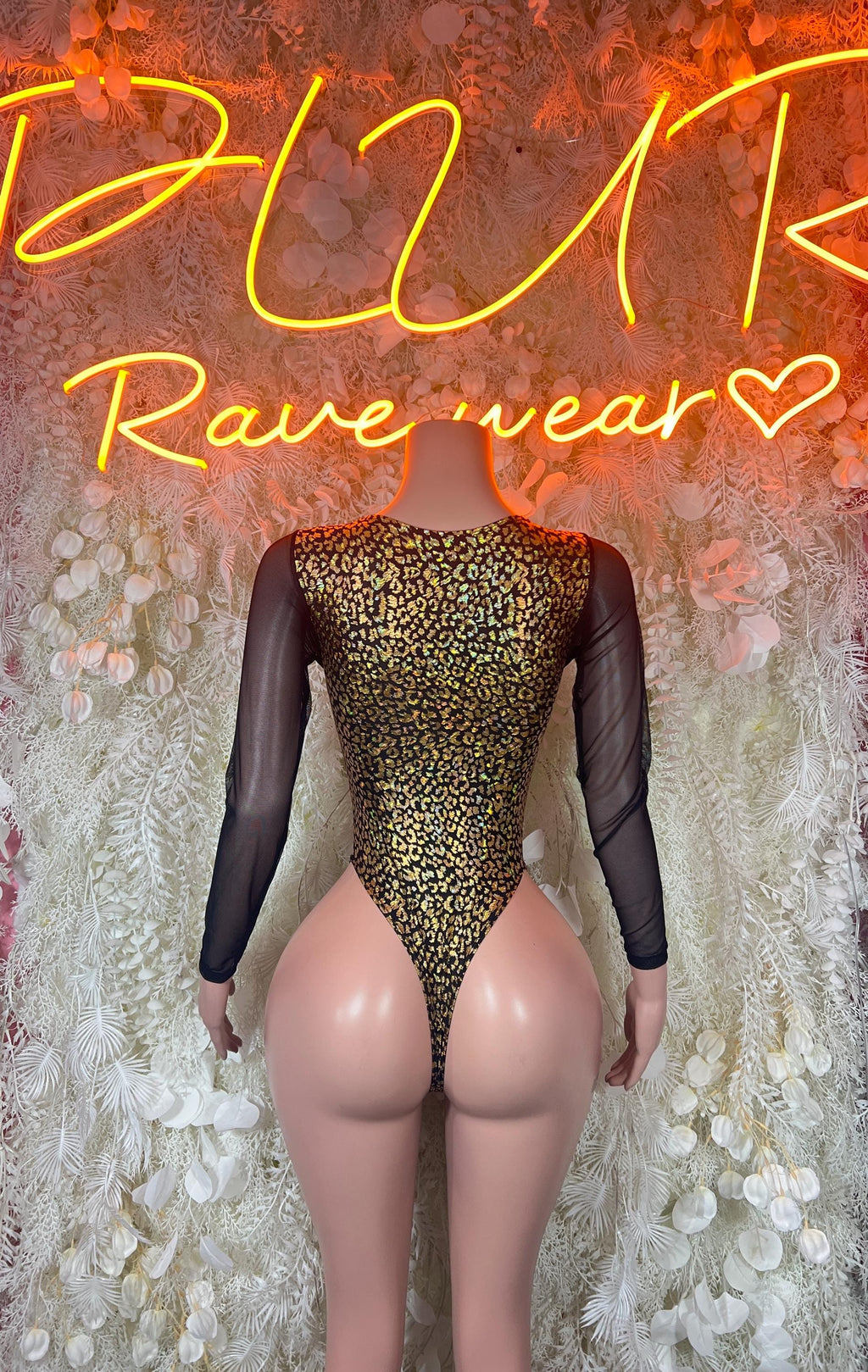 Gold cheetah print bodysuit with sheer black sleeves and deep V cutout
