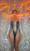 Teal cheetah rave bodysuit with white lace-up front and sheer long sleeves