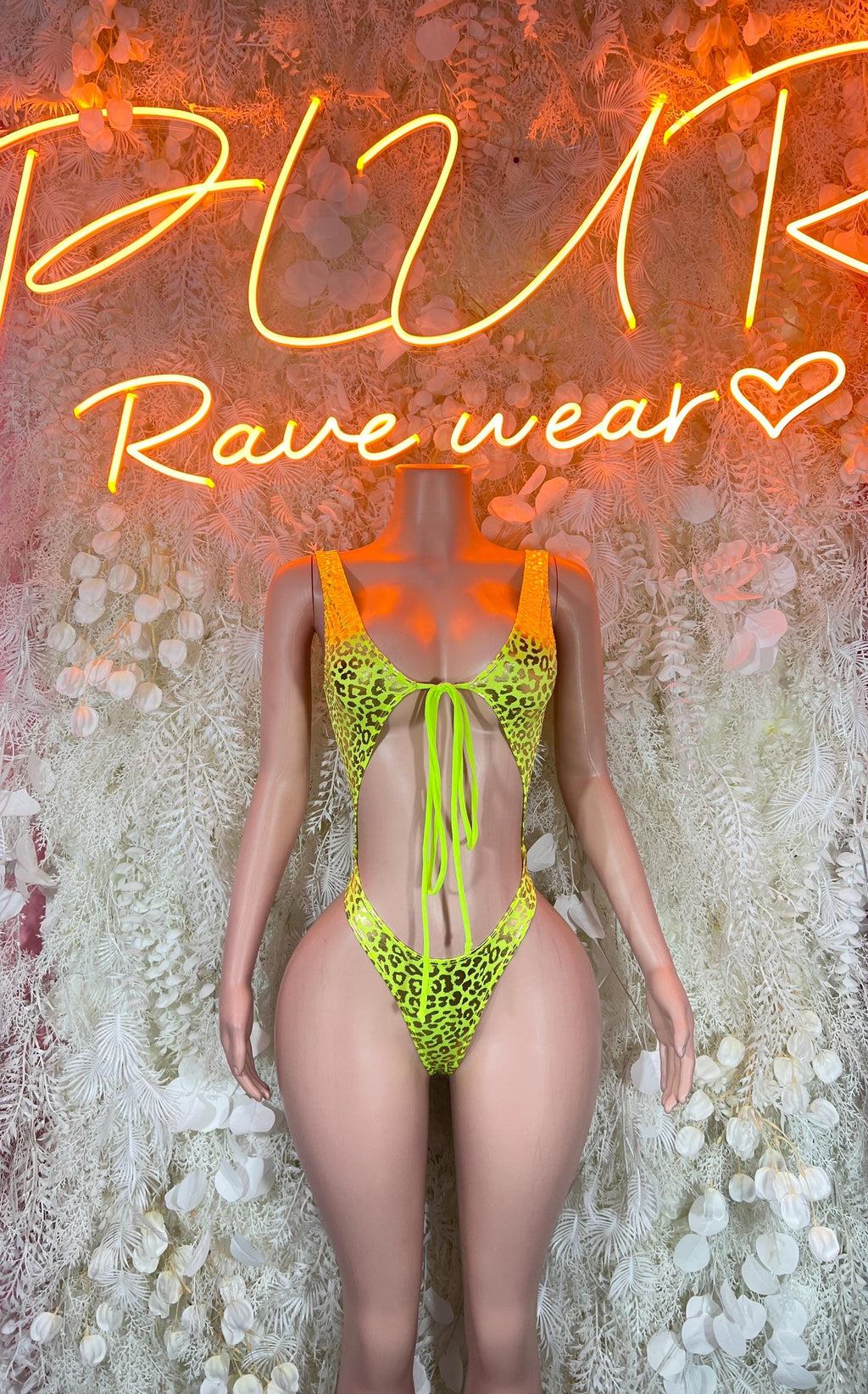 Neon green cheetah print bodysuit with front tie and strappy back