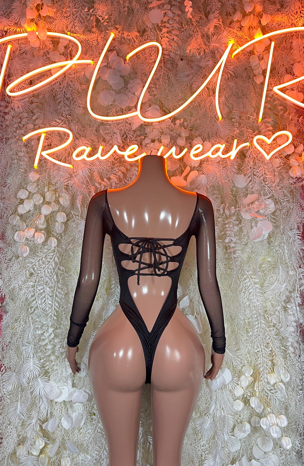 Black long-sleeve bodysuit with sheer back panel and crisscross lace-up