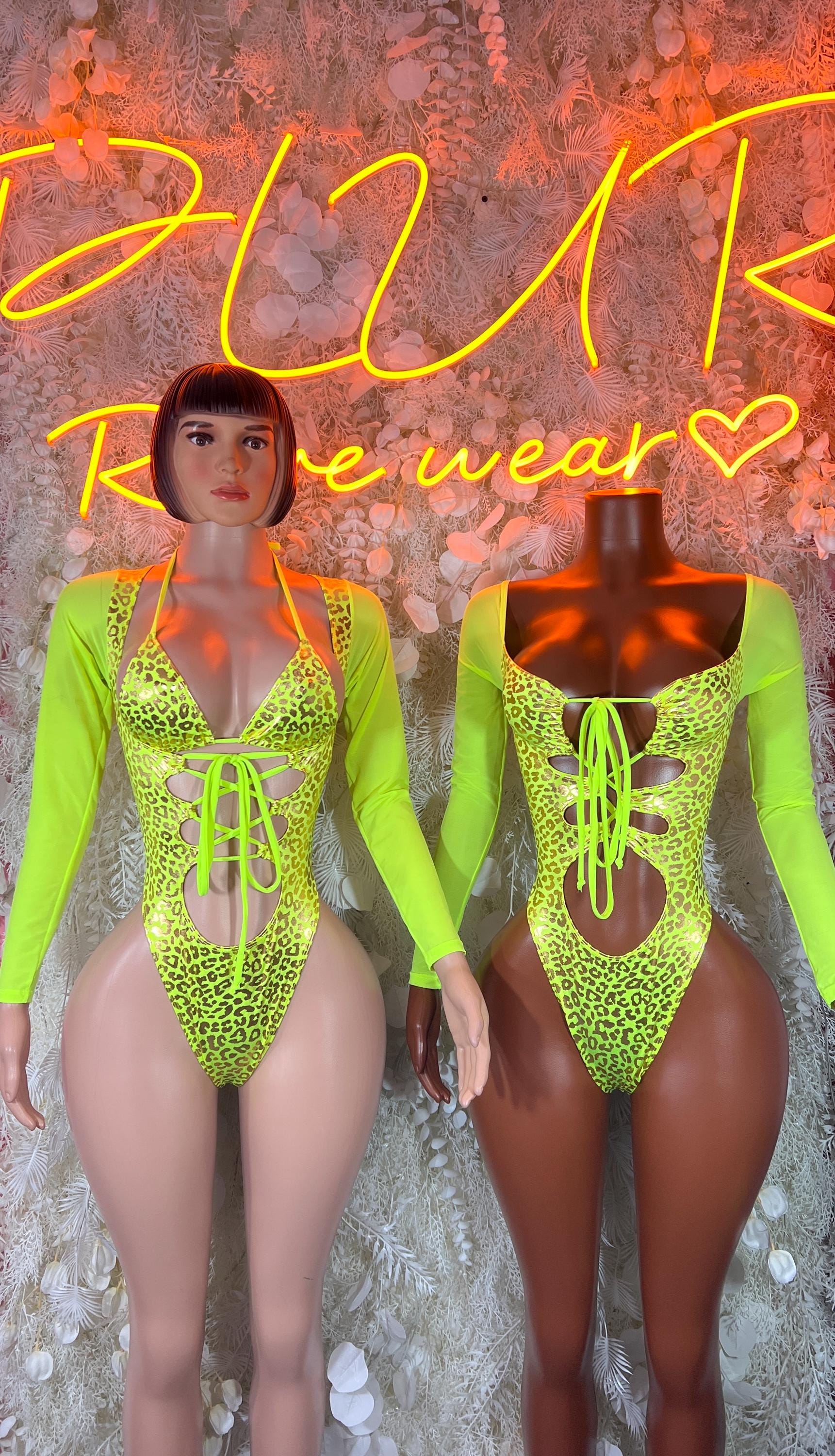 Neon green cheetah-print bodysuit, long sleeves, side view with lace-up neckline