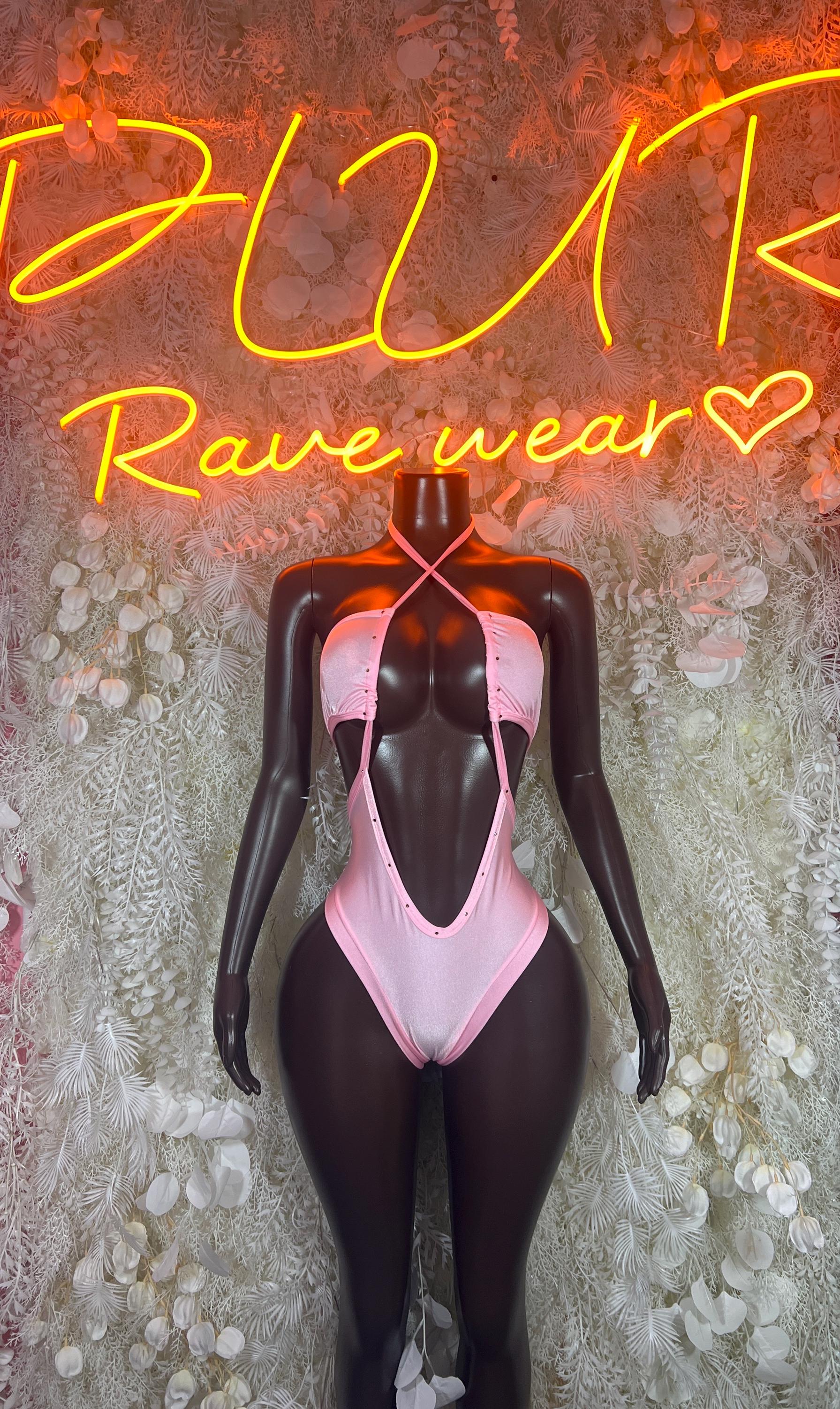 Pink rave bodysuit with halter neckline and open back, high-cut one-piece