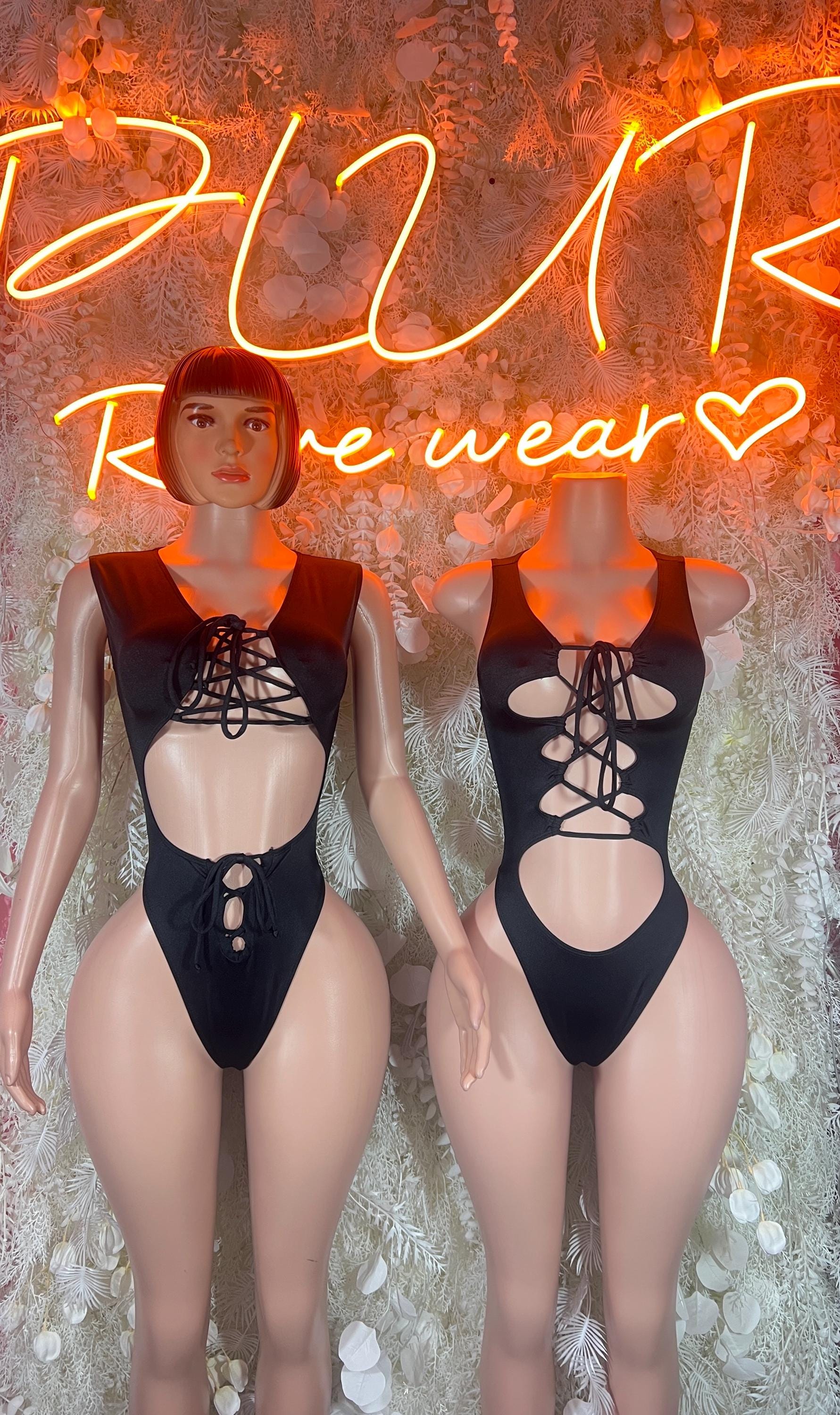 Black lace-up bodysuit, sleeveless, with front corset panel and high-cut legs