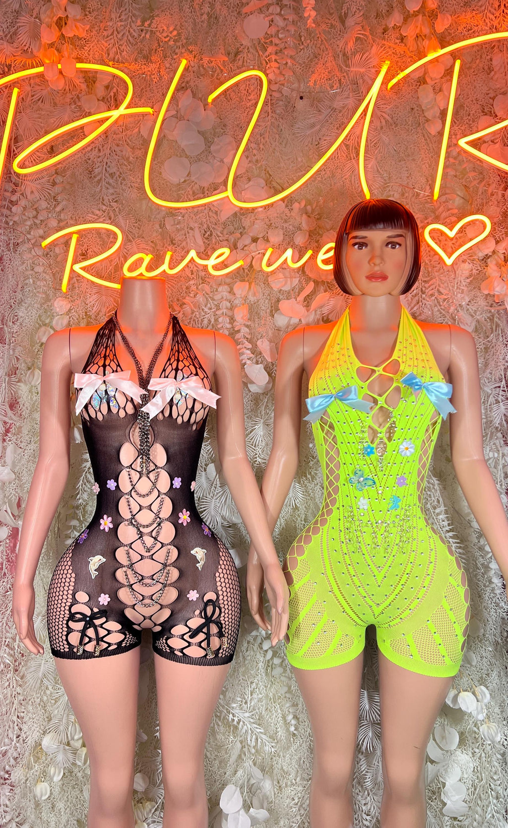 Black fishnet sleeveless bodysuit with lace-up front and high legs, front view