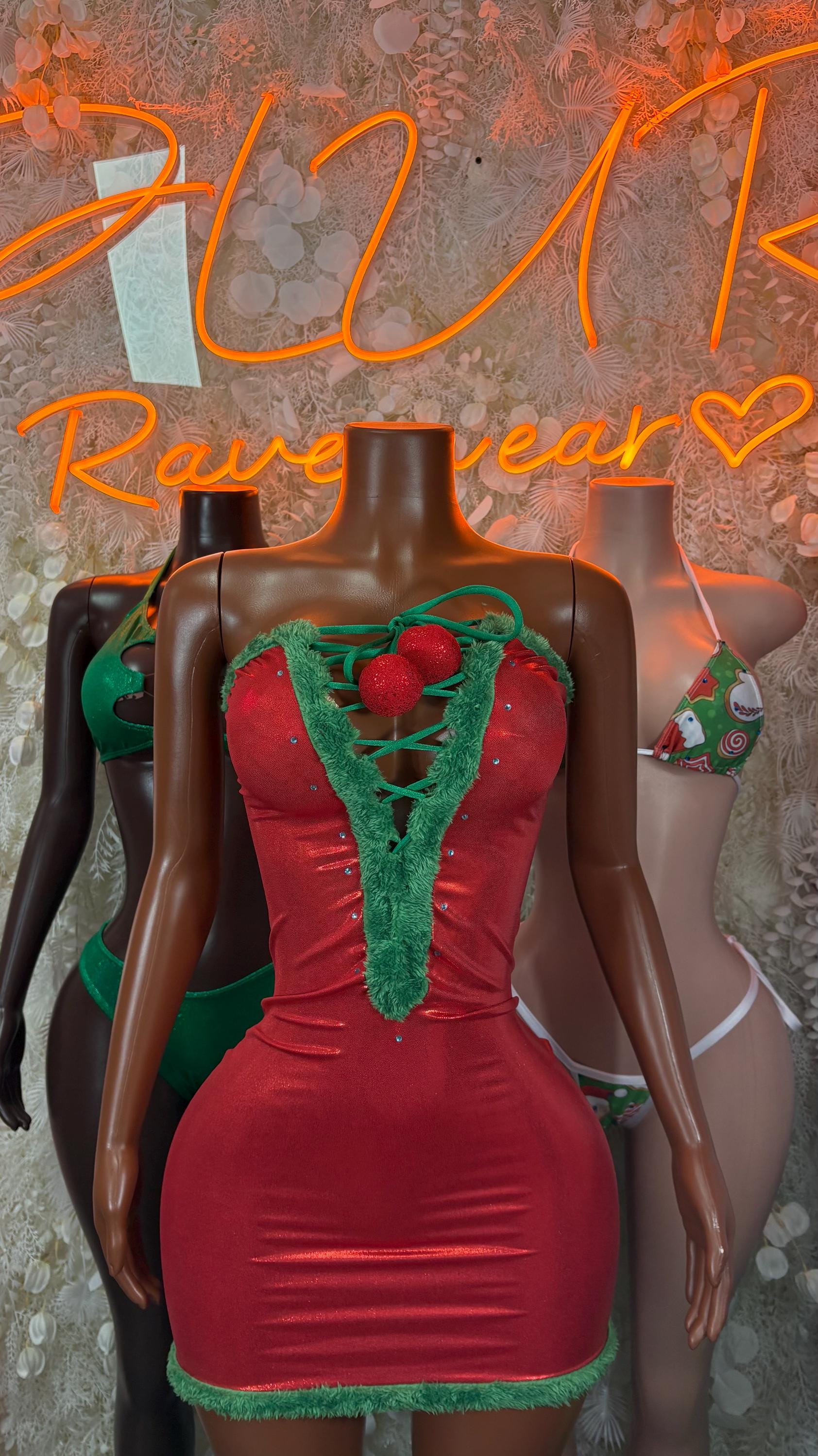 Christmas mini dress with red fabric and green lace trim at neckline