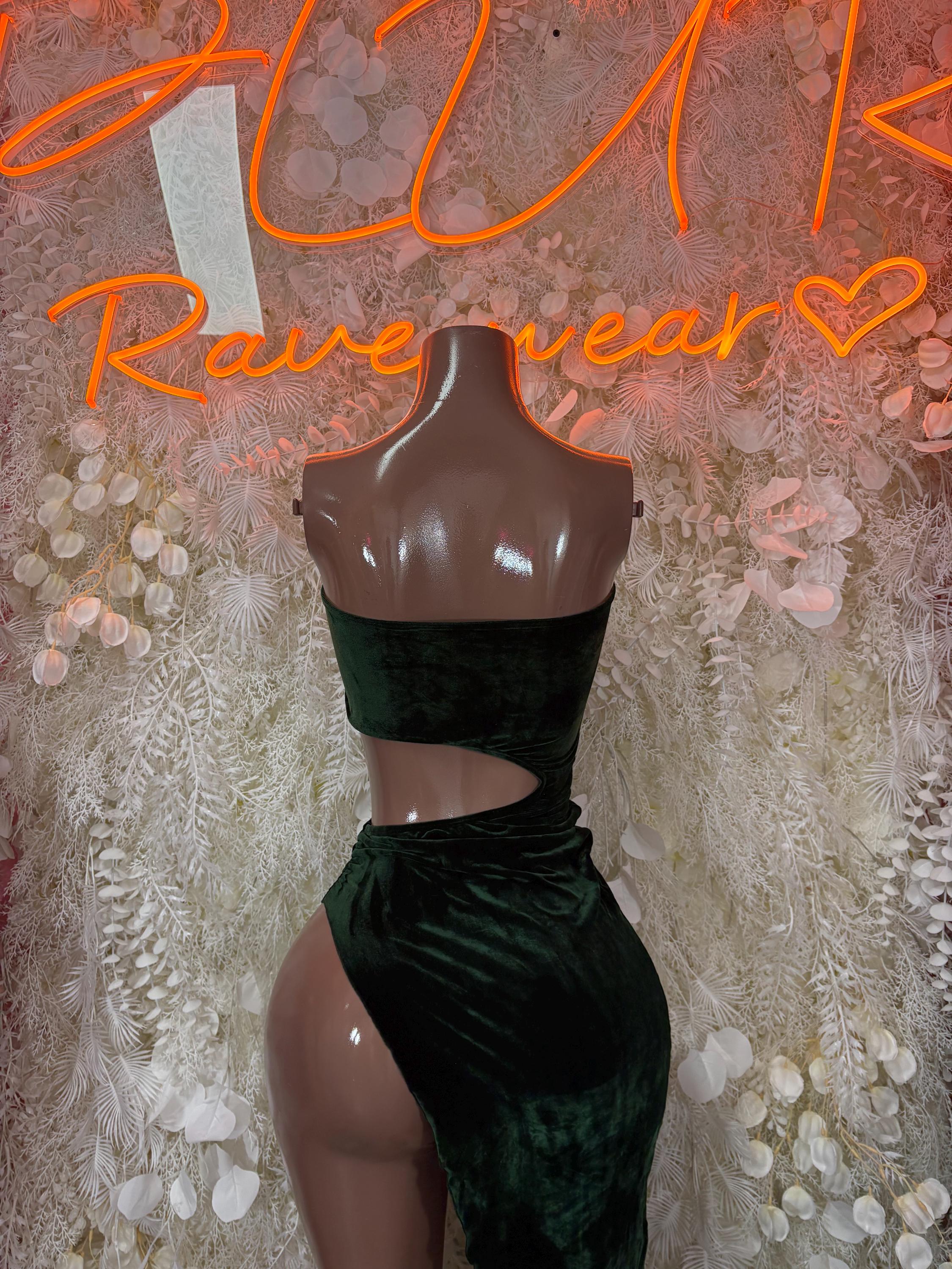 Dark green velvet dance gown with waist cutout, strapless bodice, and high-leg slit