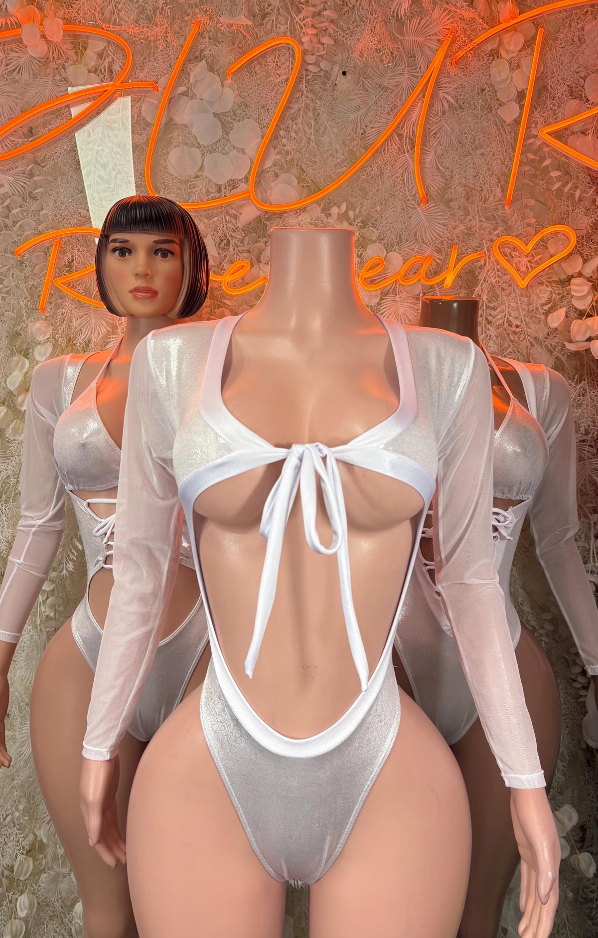 Silver metallic long-sleeve bodysuit with tied center front and plunging neckline, one-piece