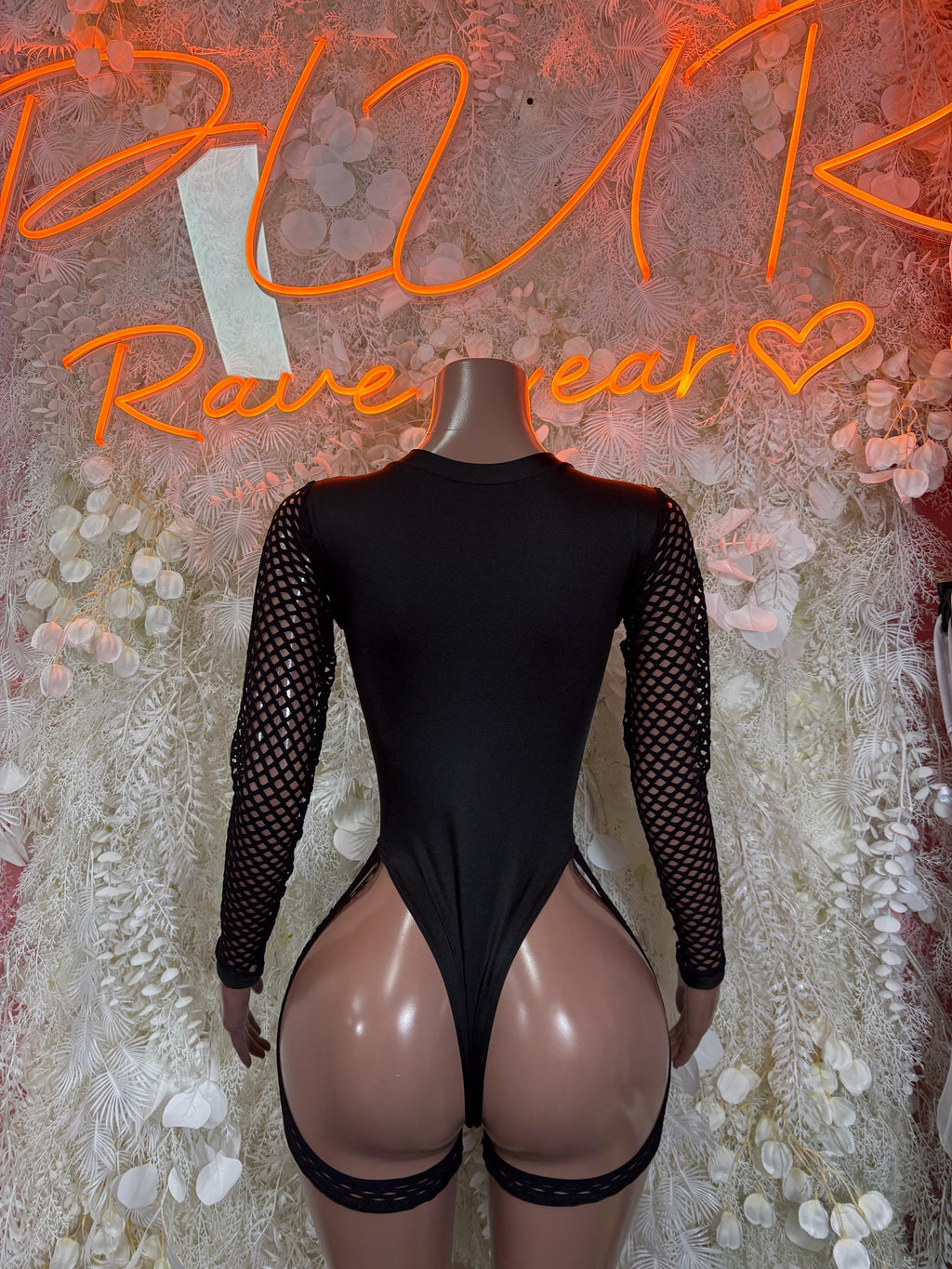 Black high-neck one-piece bodysuit with sheer mesh long sleeves and cutout sides
