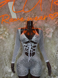 Silver hologram cheetah-print bodysuit with long sleeves, plunging corset lace-up