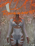 Silver cheetah-print bodysuit with lace-up neckline and cutout hips, sheer sleeves