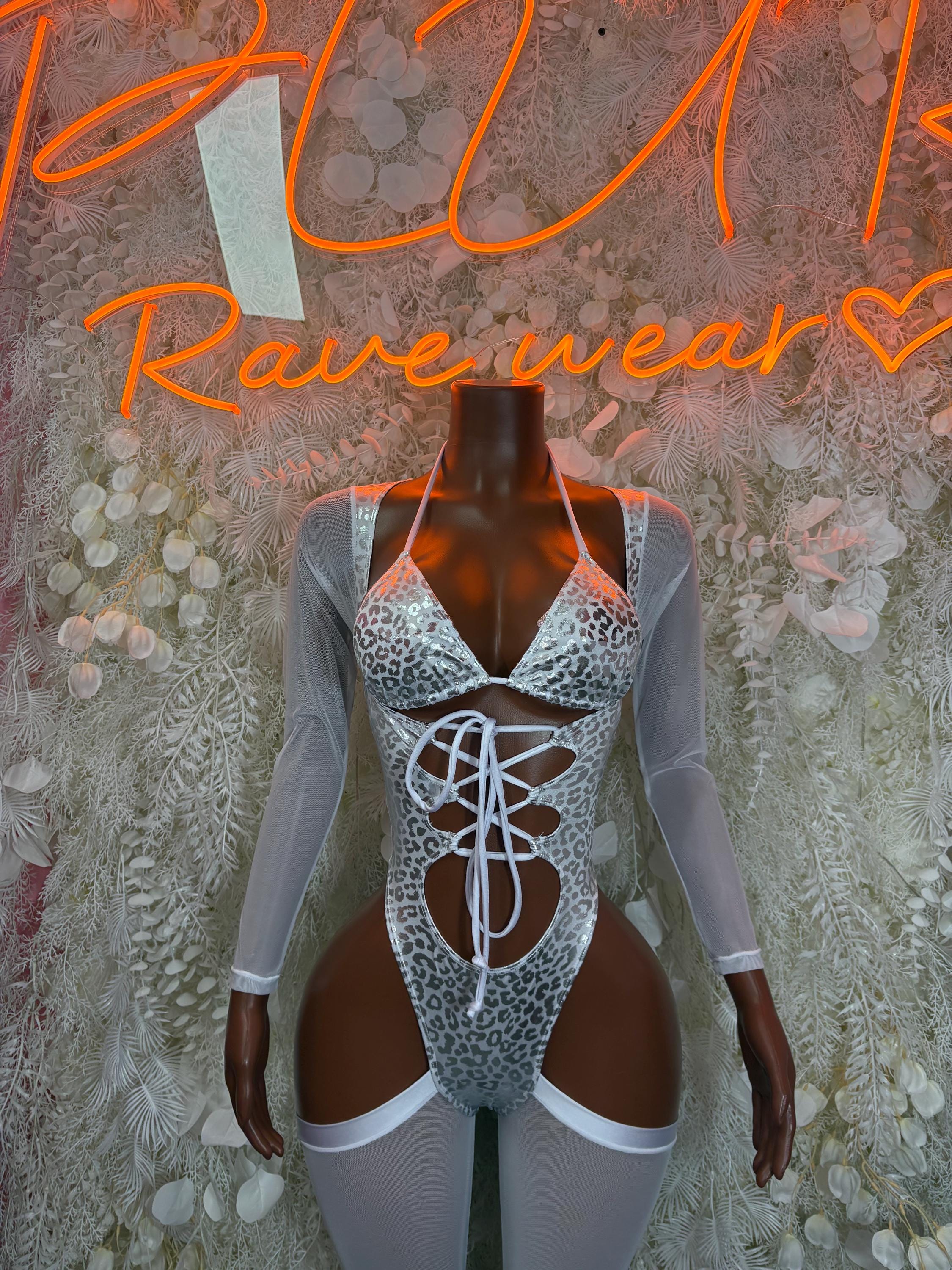 Silver cheetah-print bodysuit with long sleeves, lace-up front, and high-cut leg openings