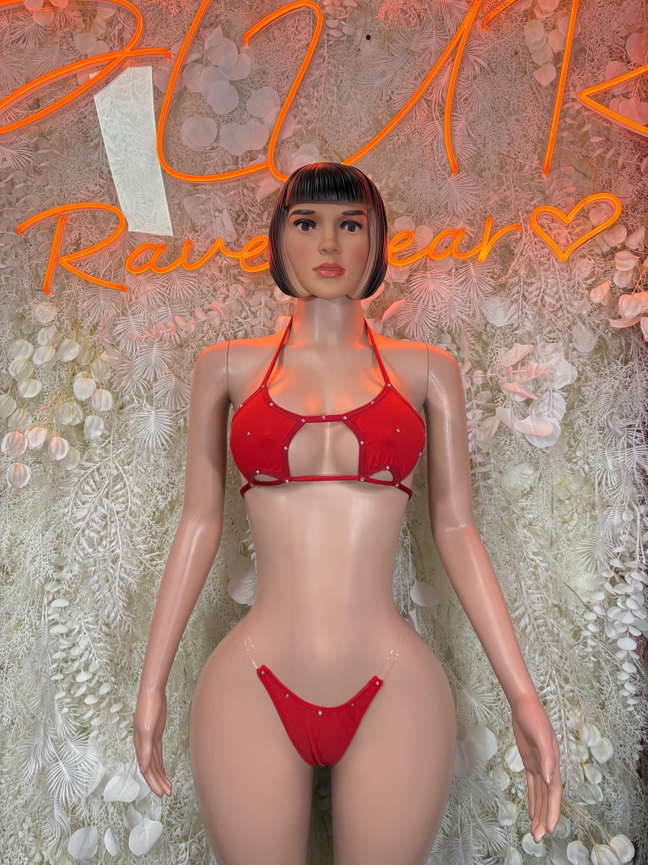 Red rave bikini with triangle top, tie-front bottoms, and silver trim accents