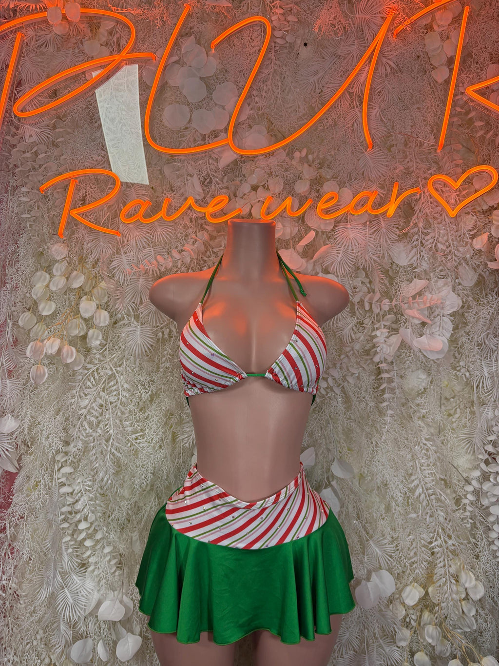 Green striped bikini bodysuit with red and white straps and green flared skirt
