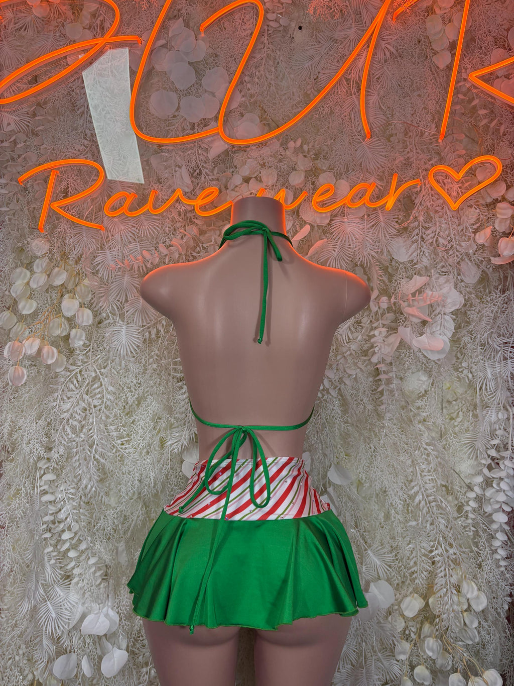 Back view green bikini bodysuit with tied halter strings and matching flared skirt