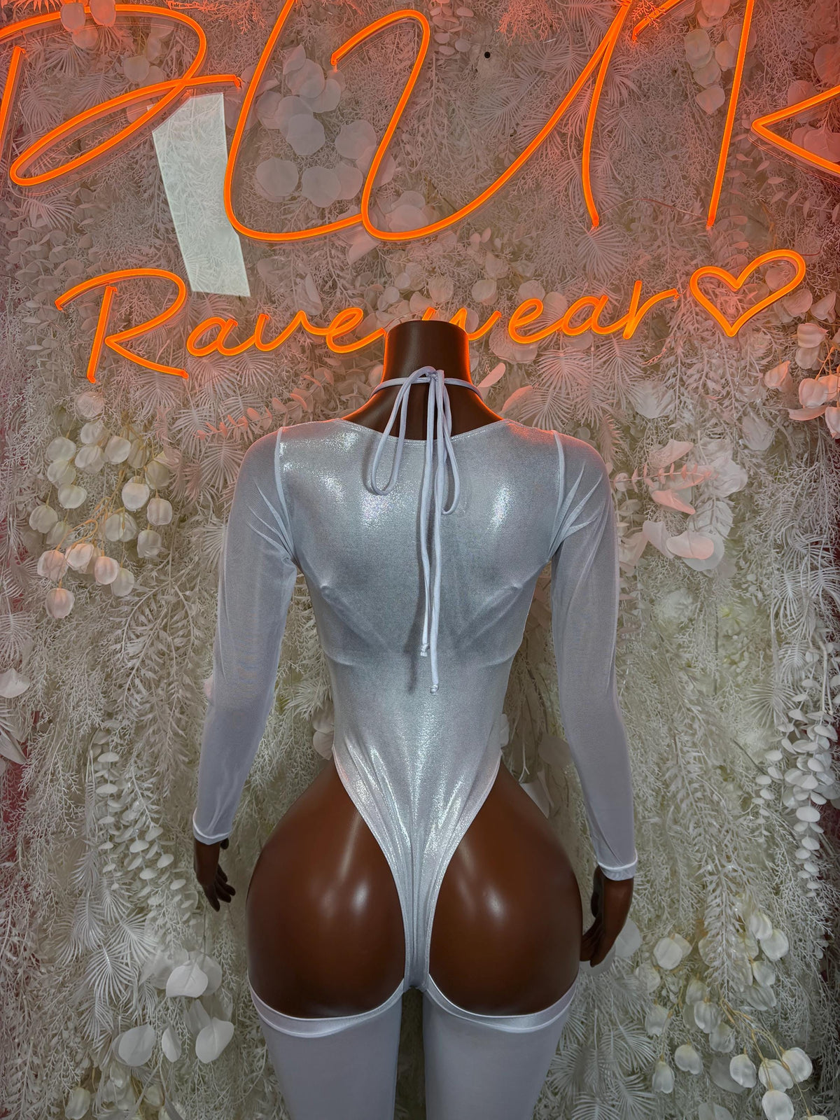 Silver metallic bodysuit with long sheer sleeves, open back lace-up design, thong cut