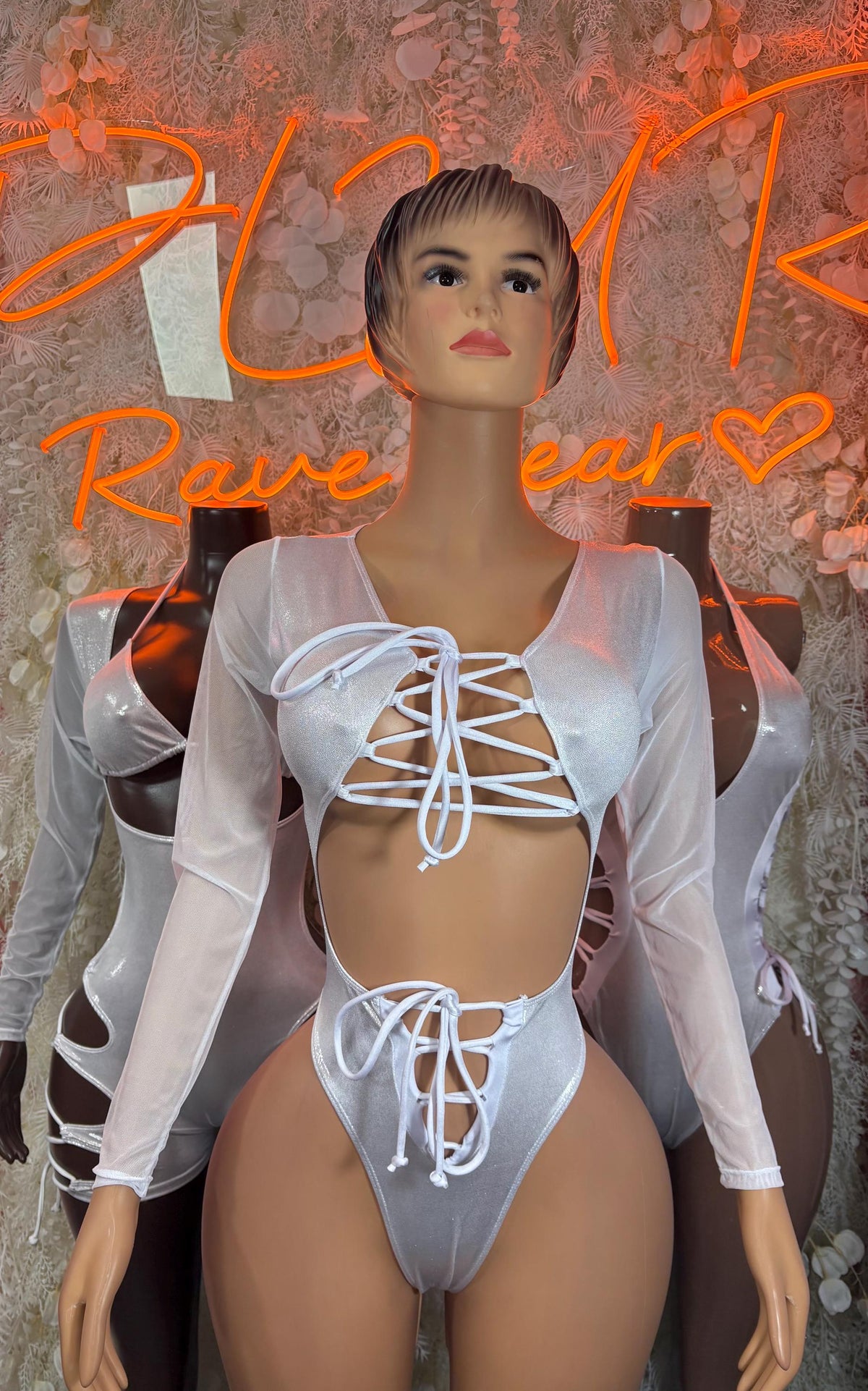Silver metallic bodysuit with long sleeves and lace-up front cutouts