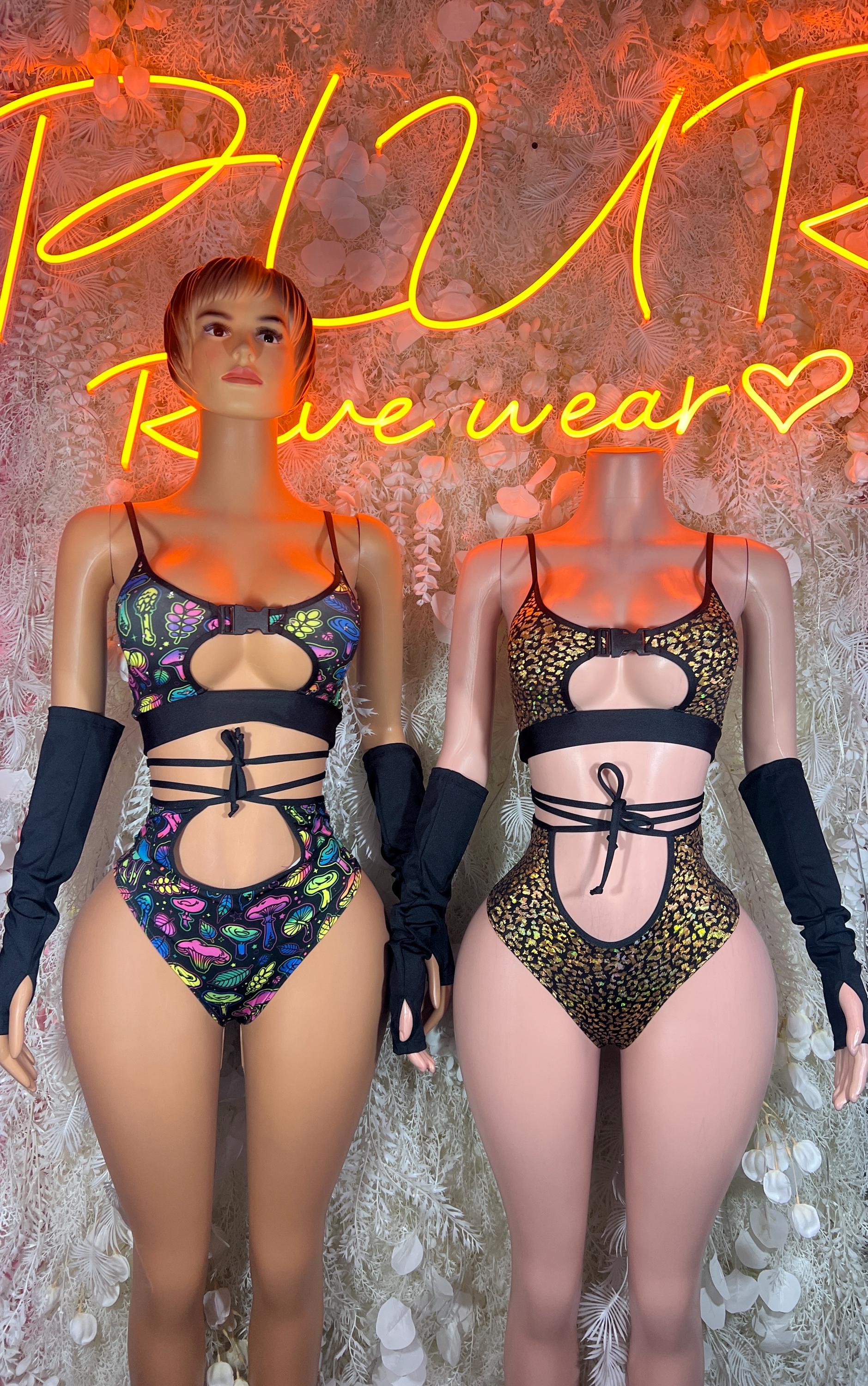 Two-piece rave swim set shown front and back with multicolor mushroom print and black arm warmers