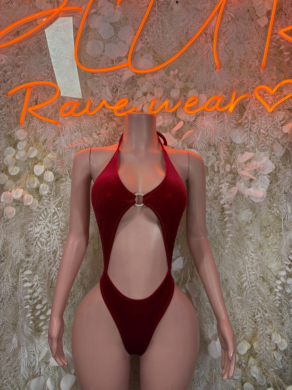 Red velvet bodysuit with halter straps, plunging V neckline and keyhole ring detail