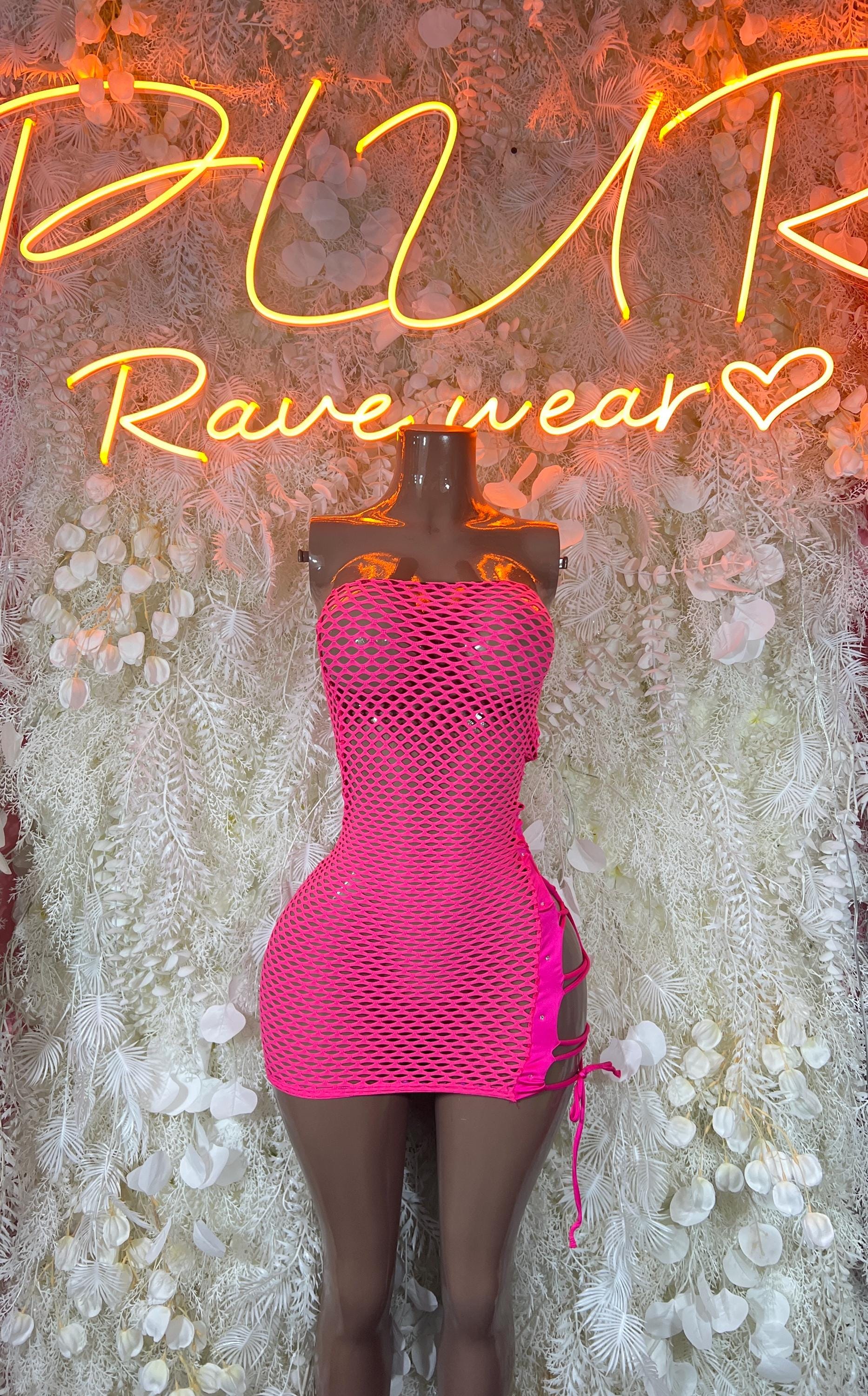 Pink fishnet bodysuit dress, sleeveless square neckline, short hem, tie side straps