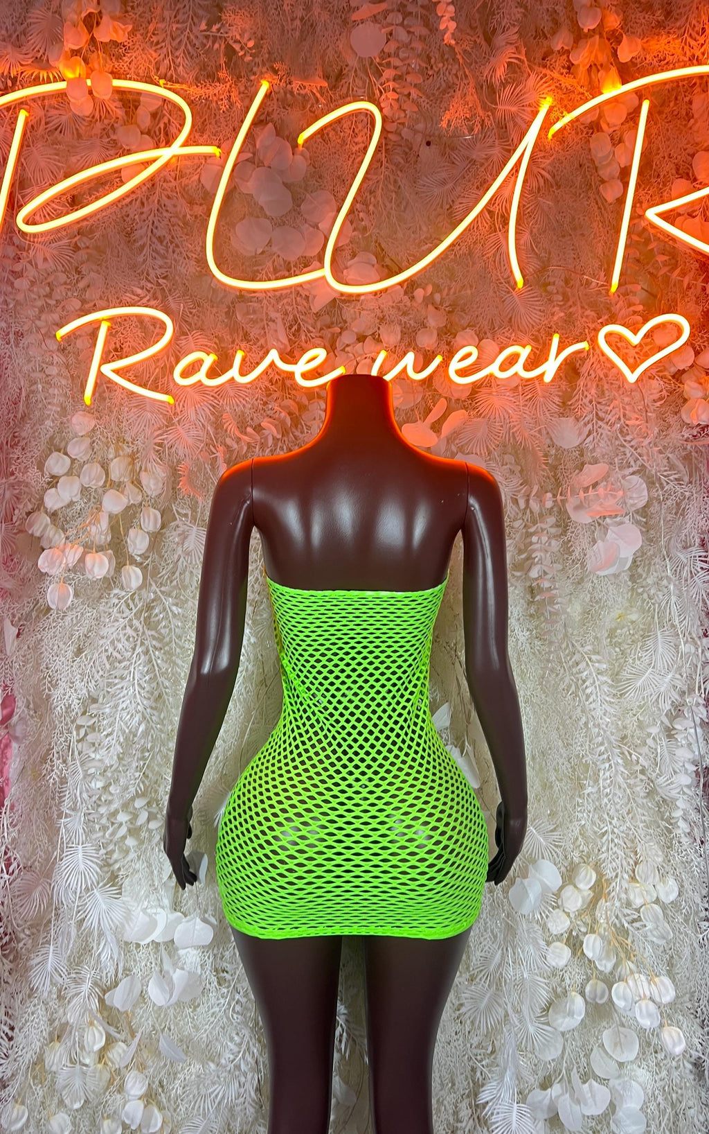 Neon green fishnet mini dress with scoop back and lace-up front