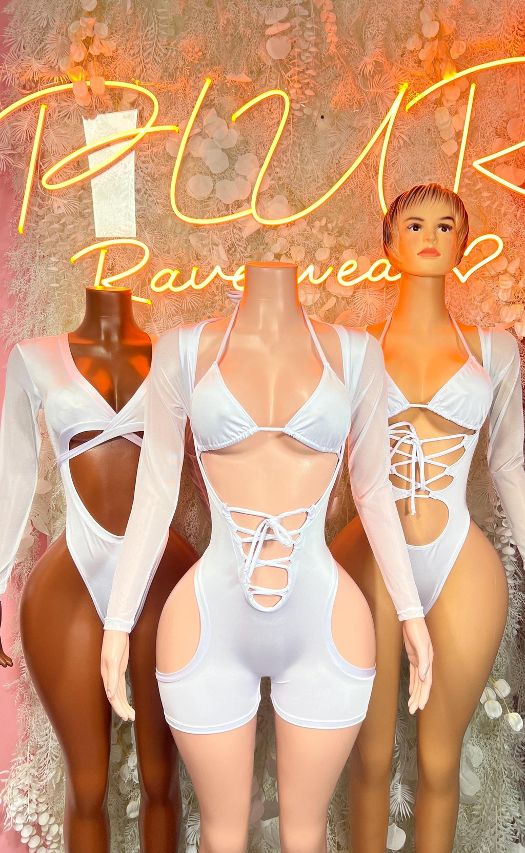 Light blue long-sleeve lace-up cutout bodysuit with high-leg shorts and deep neckline