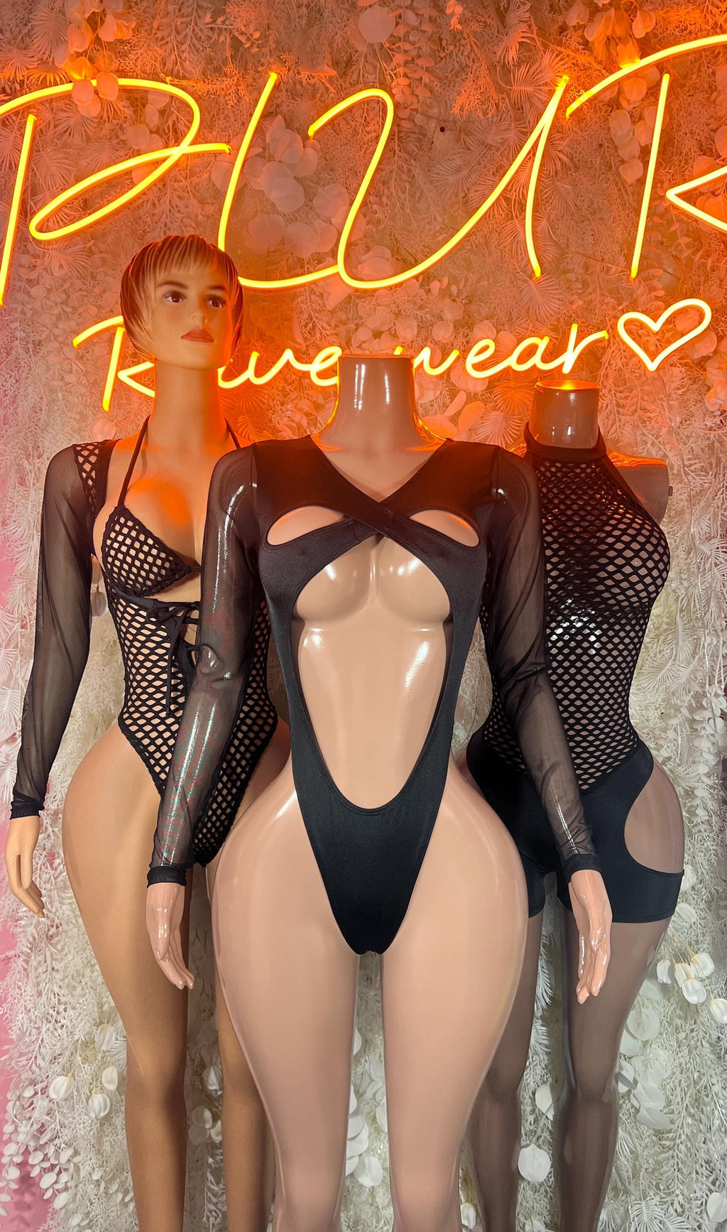 Black fishnet long-sleeve bodysuit with front cutout and high-leg bottoms