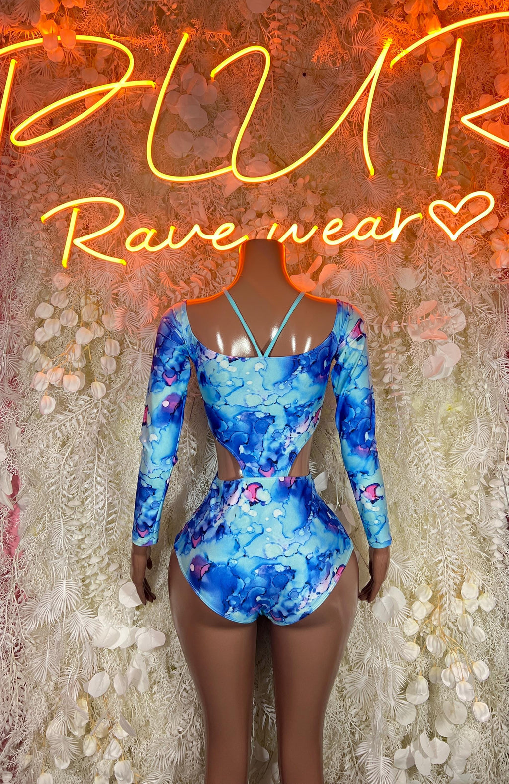 Blue long-sleeve rave bodysuit with high scoop neckline, fitted one-piece, allover print