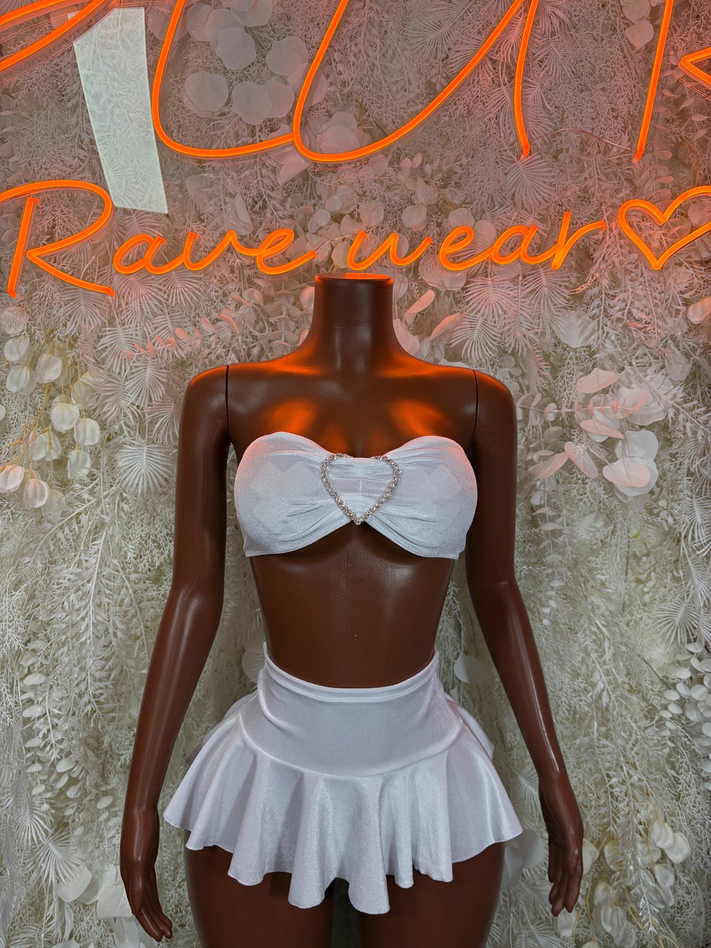 White bandeau top and ruffled mini skirt set, heart bow front